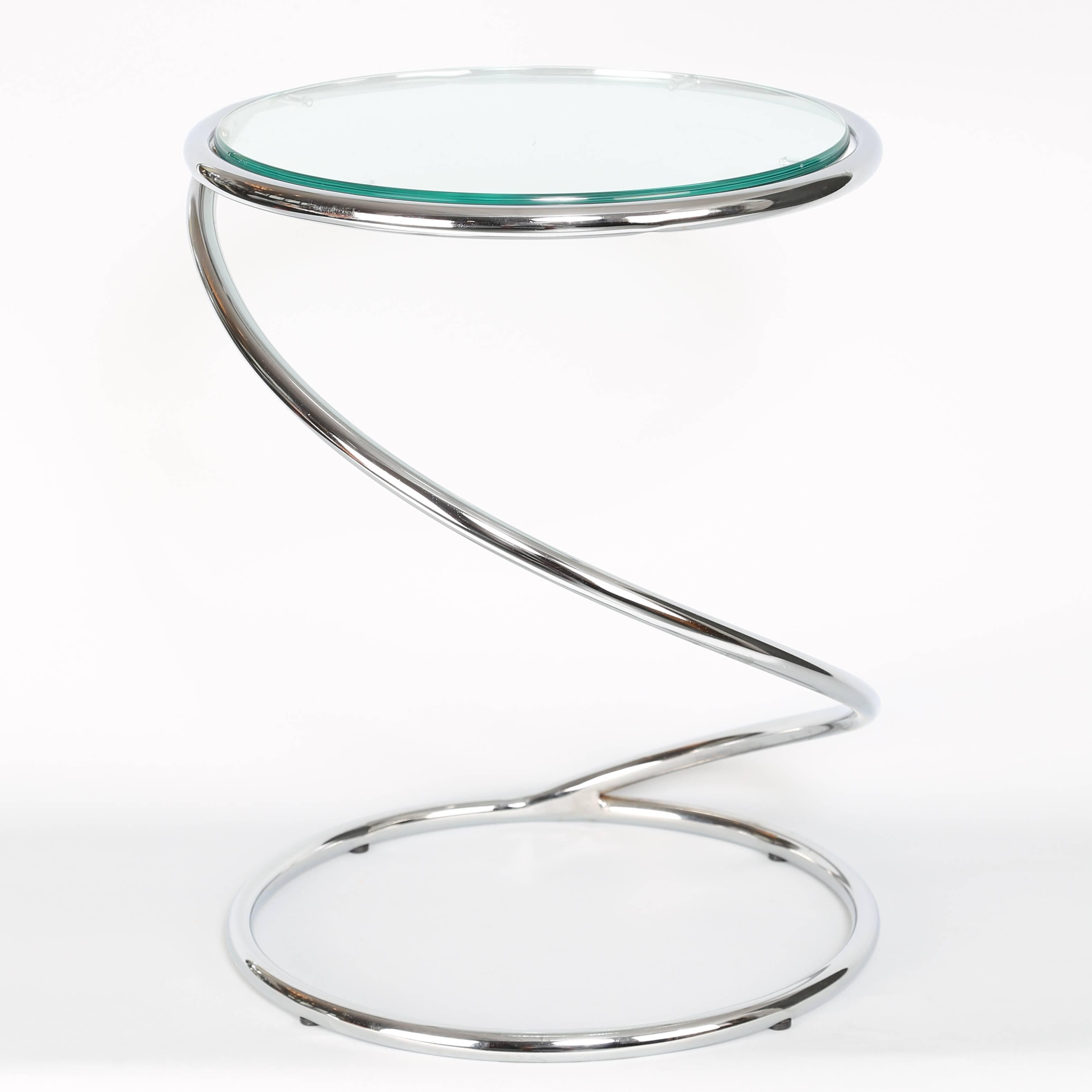 Fun 1970s chrome side table in the form of a spring, by Pace Collection. Half-inch thick glass rests in circular top. 


