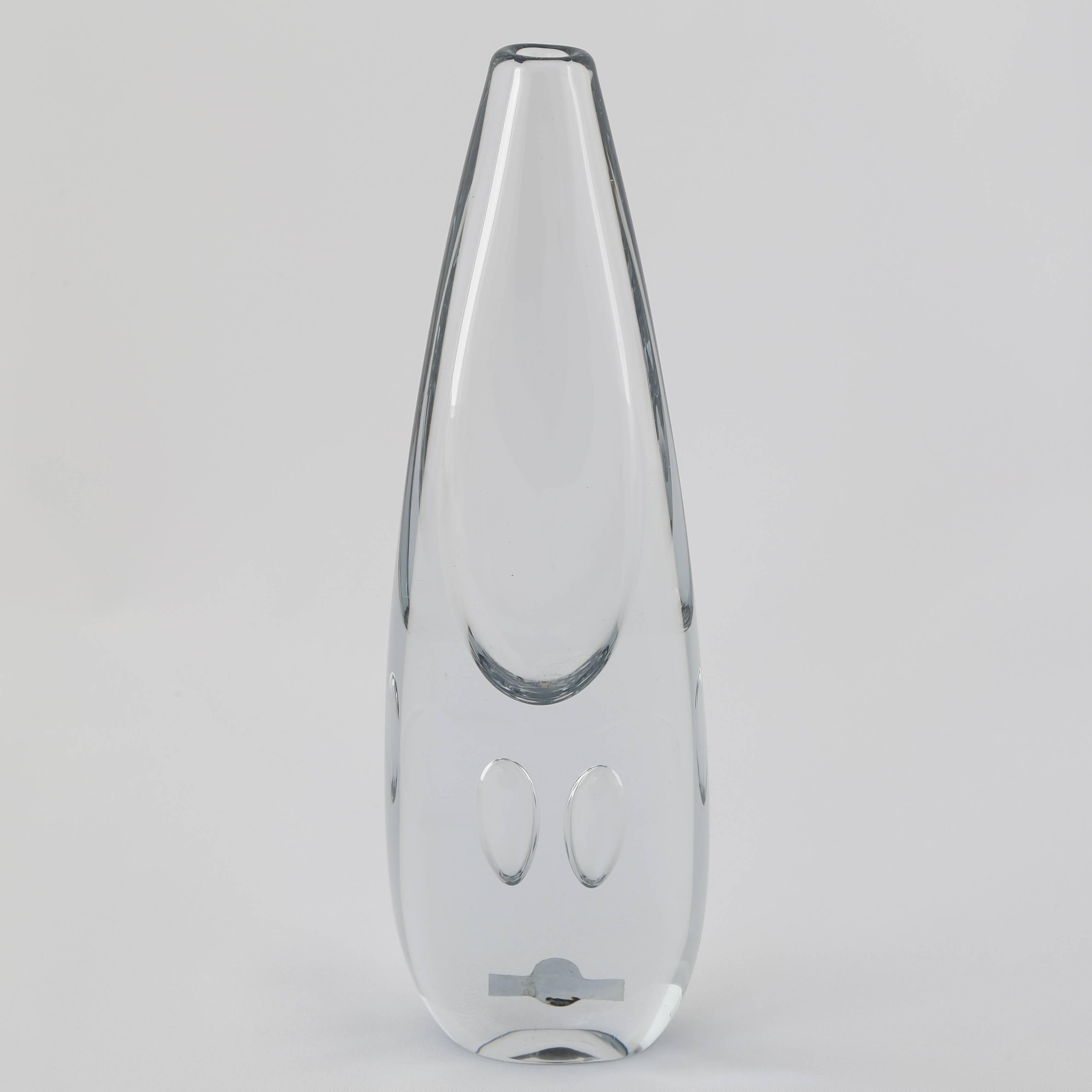 A lovely, hand-blown, teardrop vase with two suspended bubbles in Strombergshyttan's signature blue-silver glass. Sweden, circa 1950s. Strombergshyttan label. 

Lindfors Glassworks was founded in 1876 and changed its name to Strombergshyttan in