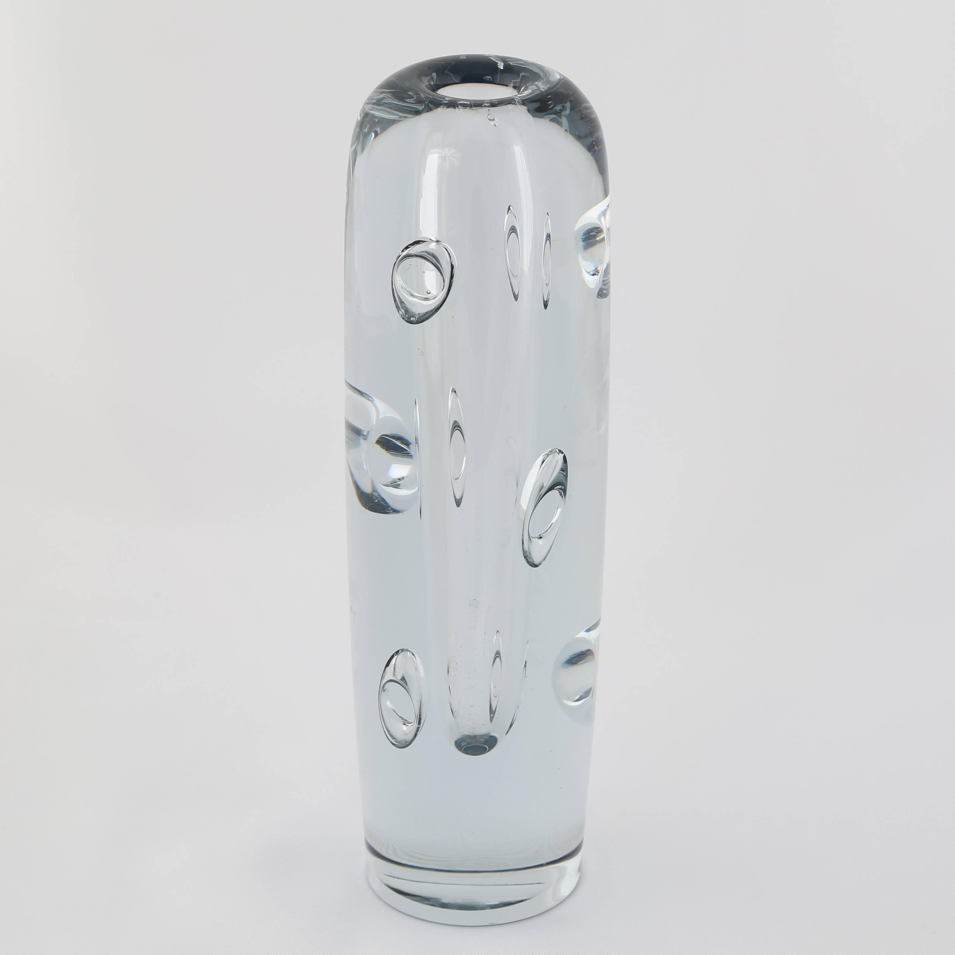 Substantial glass bud vase with amazing ring-shaped bubbles throughout in Strombergshyttan's signature blue-silver glass. Sweden, circa 1950s. Etched 
