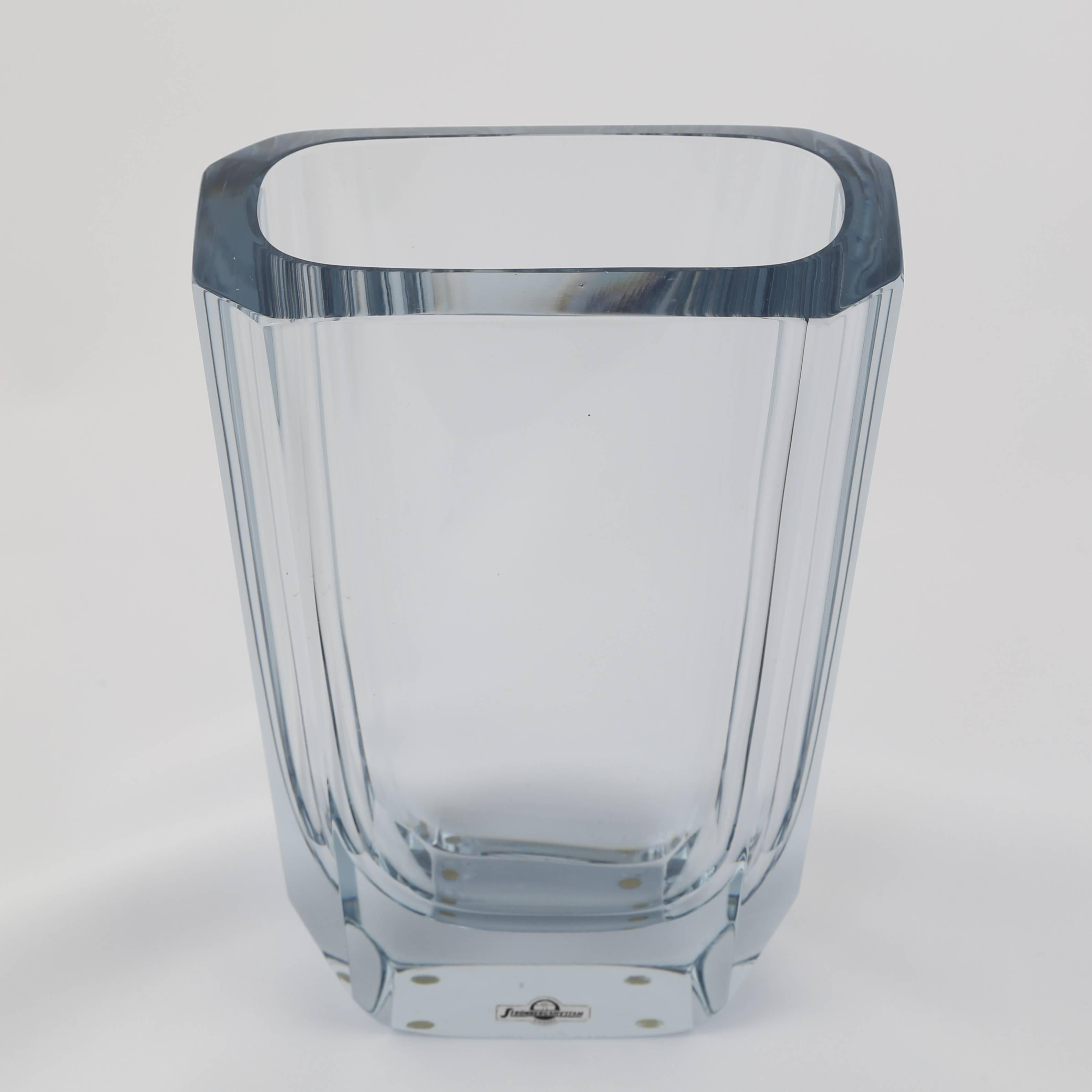 This substantial octagonal vase features large cut facets in Strombergshyttan's signature blue-silver glass. Sweden, circa 1950s. Paper label on side and etched 