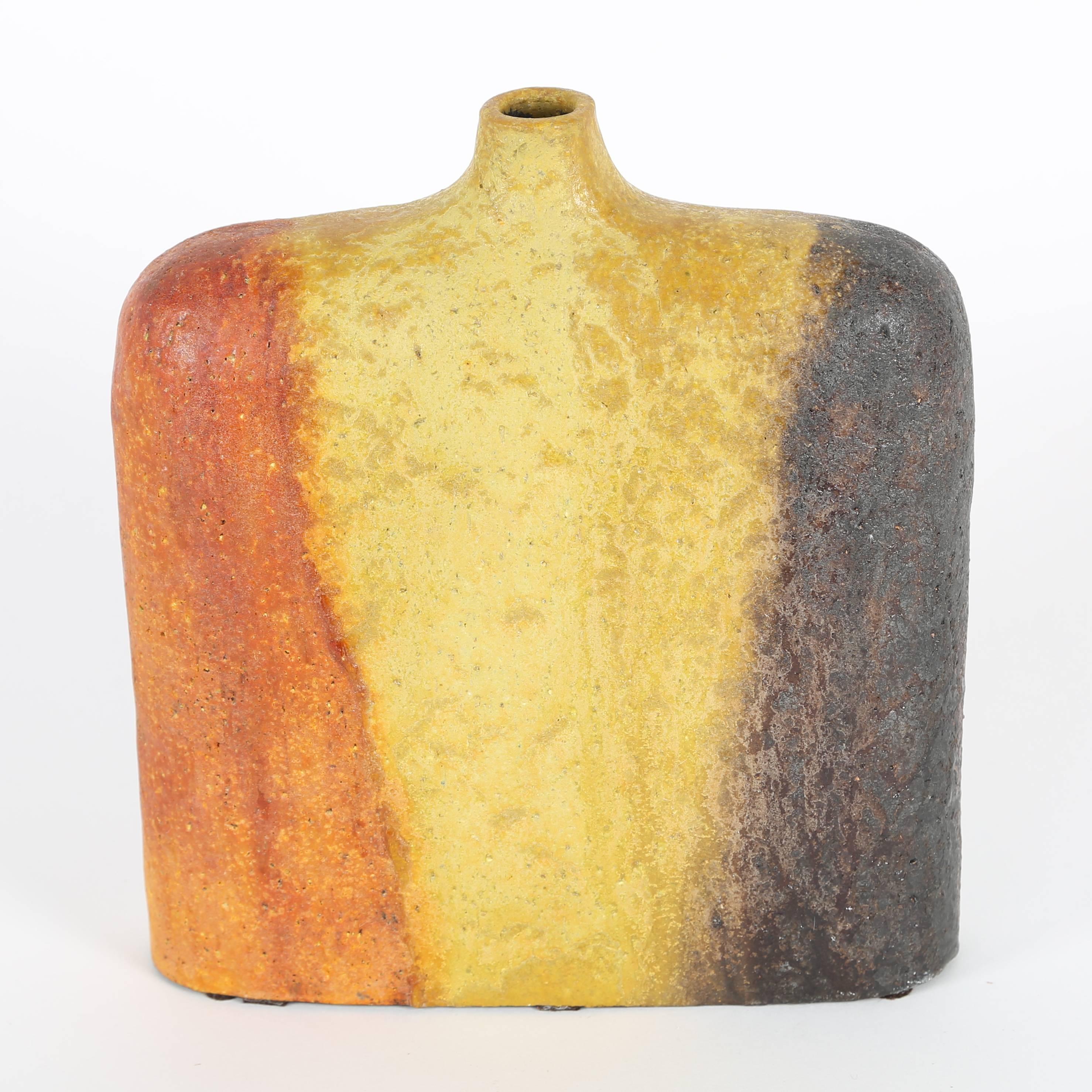 Large, 1960s Marcello Fantoni for Raymor vase with slender profile featuring bands of orange, yellow and brown with a thick and textured glaze. 