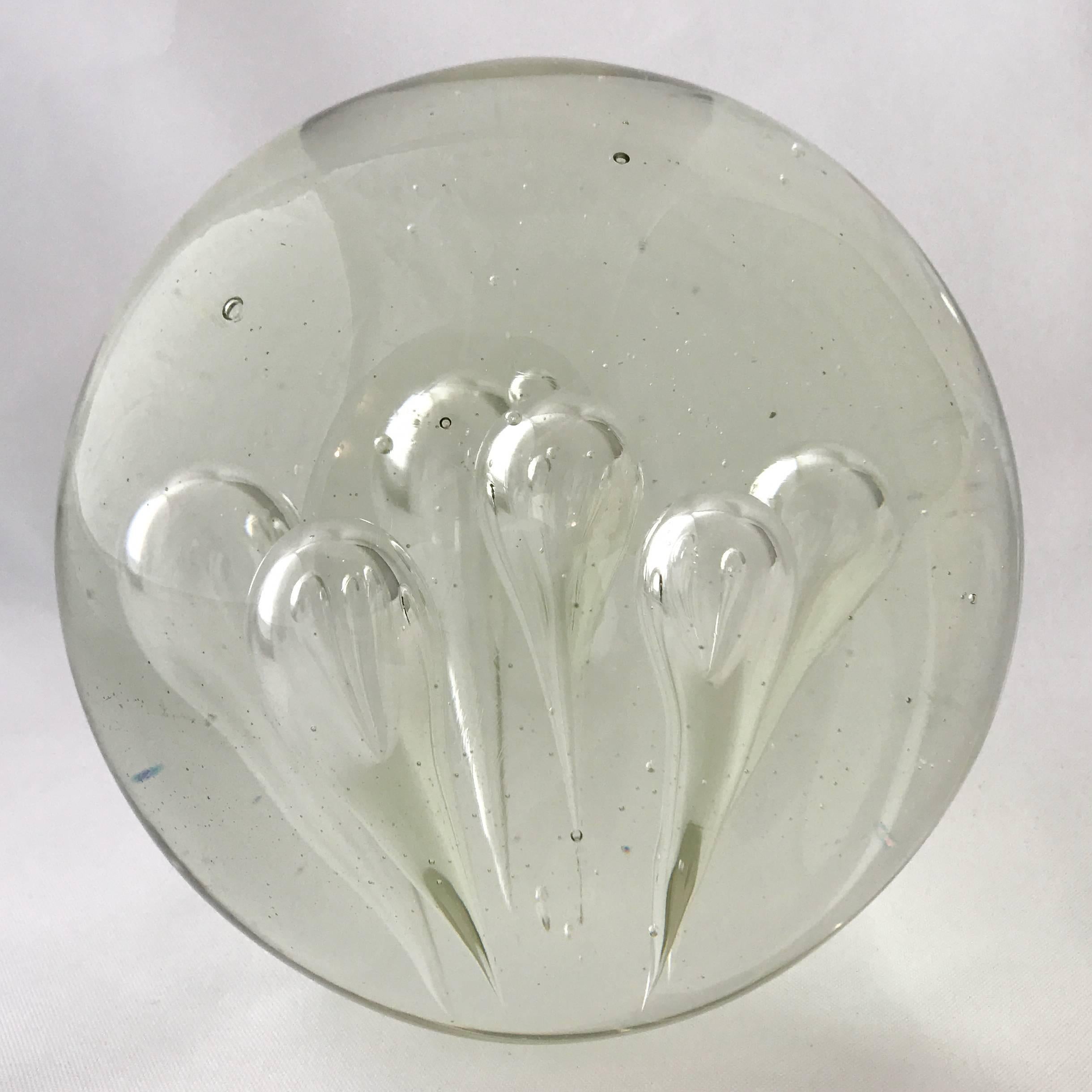 Large decorative Murano glass sphere with six large teardrop-shaped internal bubbles. A beautiful sculptural object on its own, or would make a substantial bookend. 


