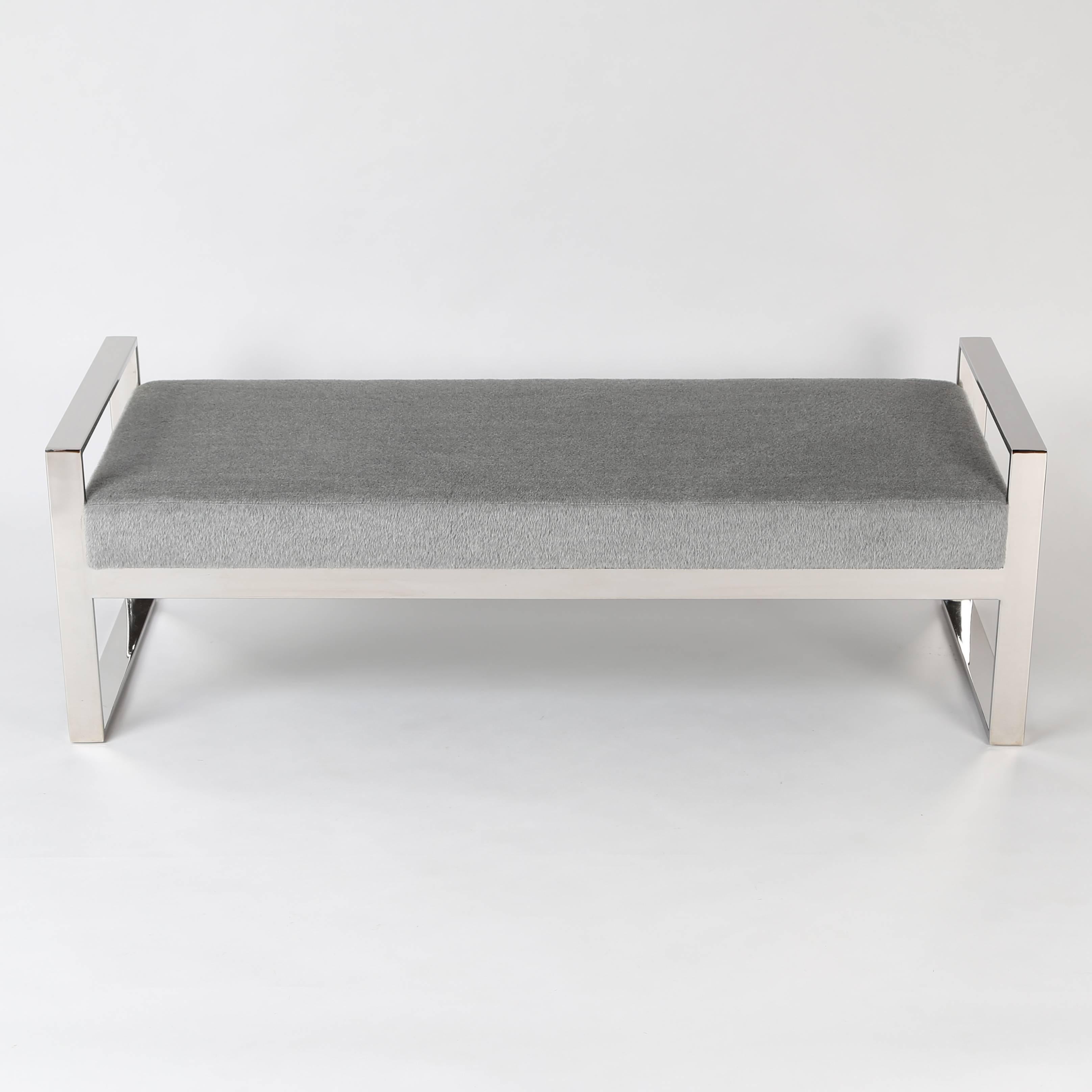Nicely scaled bench with an open, polished-chrome frame. The comfortable upholstered seat has been recovered in a soft, super-luxe mohair and wool fabric. 


