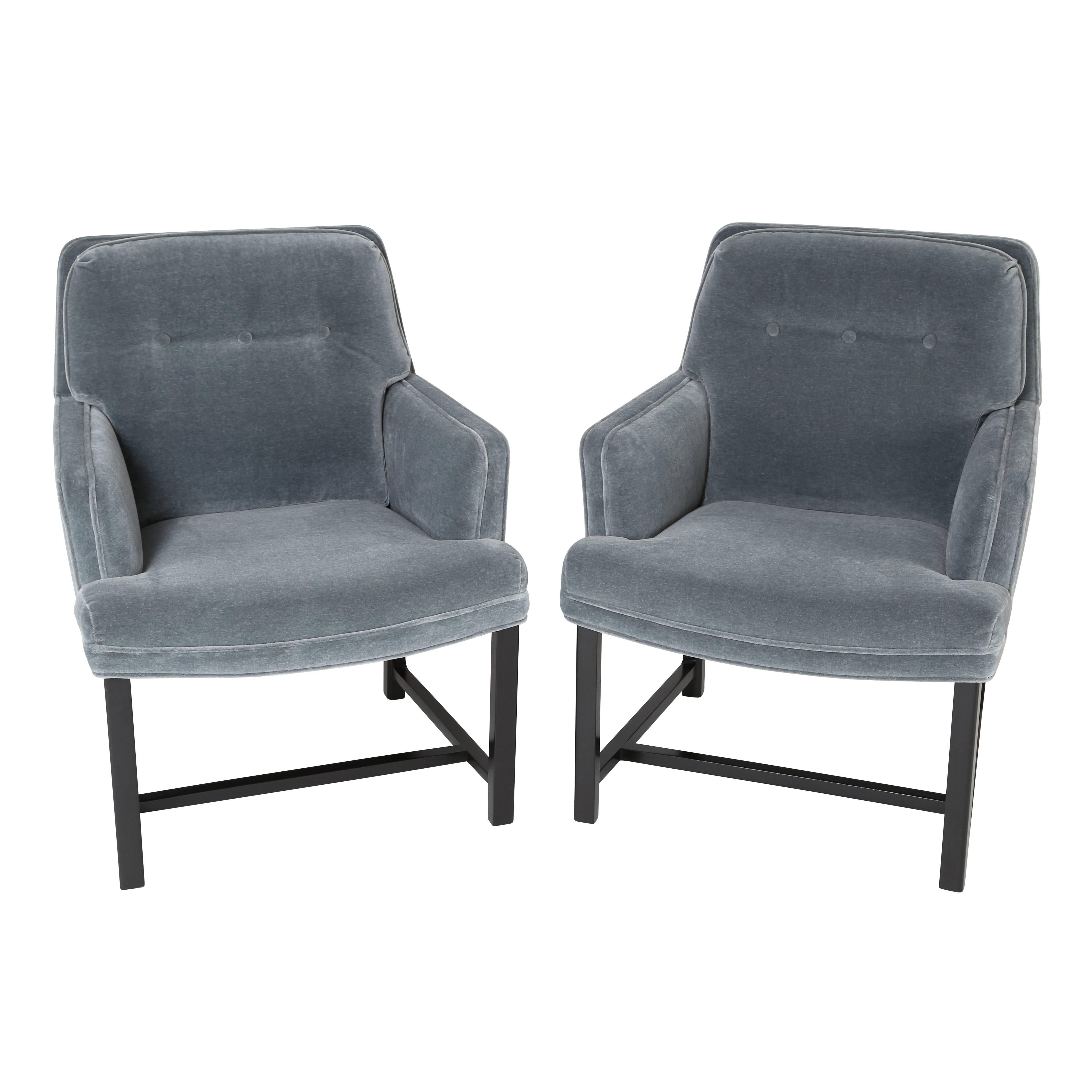 This fine pair of armchairs designed by Edward Wormley reflects Dunbar's signature high-quality construction. Sturdy and versatile, these chairs have been professionally refinished and newly reupholstered in a grey-blue mohair velvet. 28