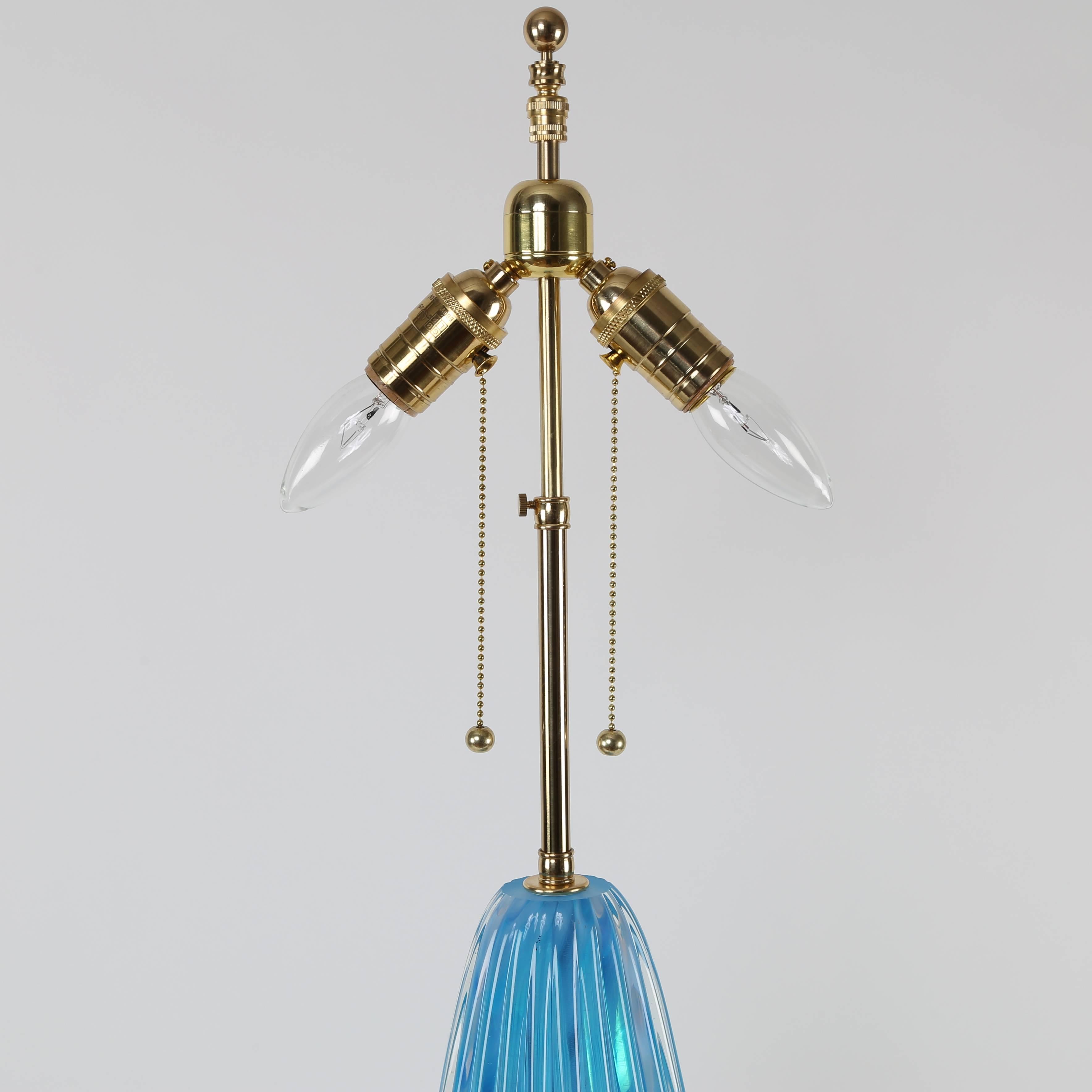 Lovely vivid-blue Murano glass table lamp with gilded base, circa 1950s. New polished-brass hardware with two pull-chain sockets and new wiring. Base is 6-1/2