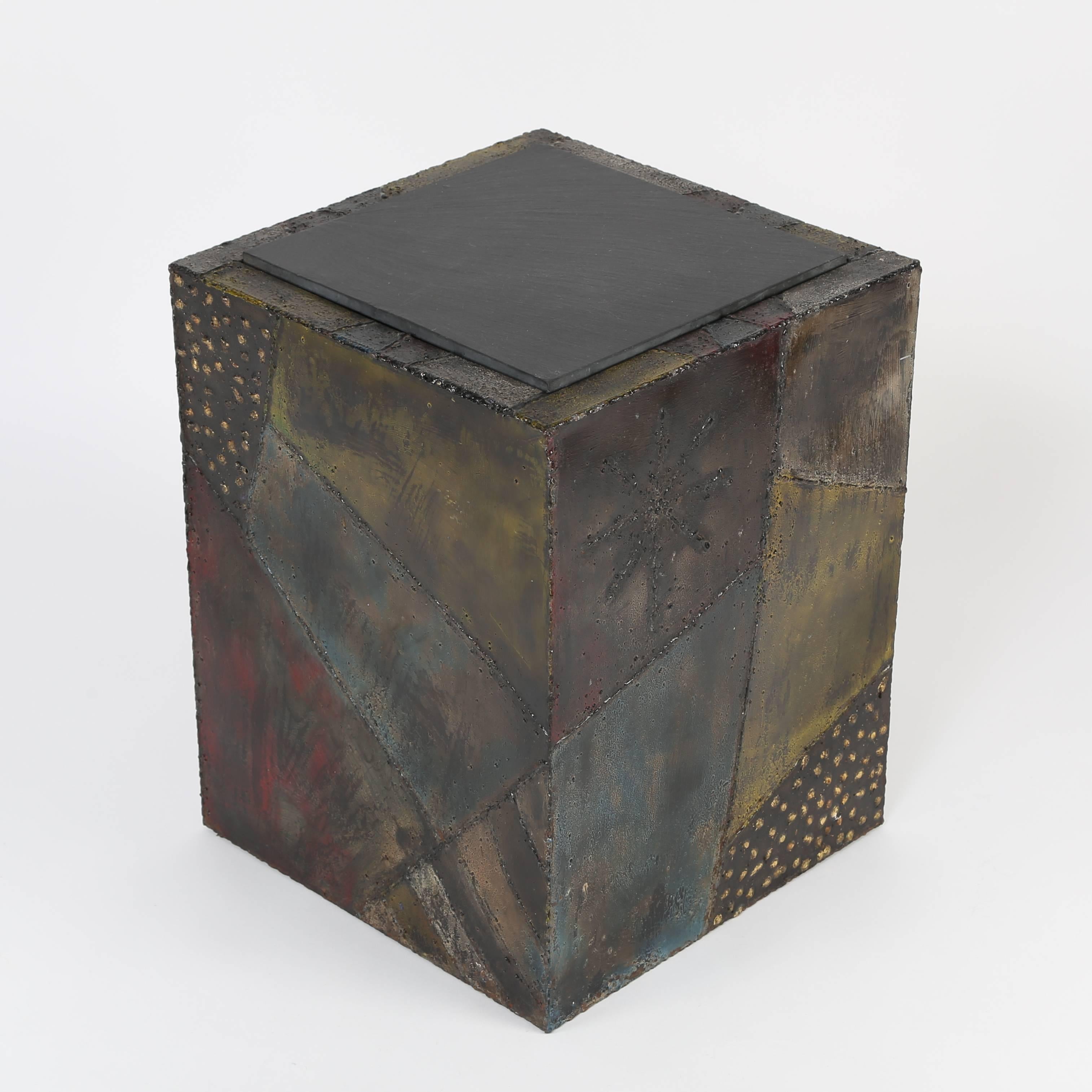 Exceptional welded and polychromed steel cube occasional table with slate top by Paul Evans for Directional Furniture, model PE-20, circa 1967. Each side features a different welded patchwork of Evans' iconic patterns, including starbursts,