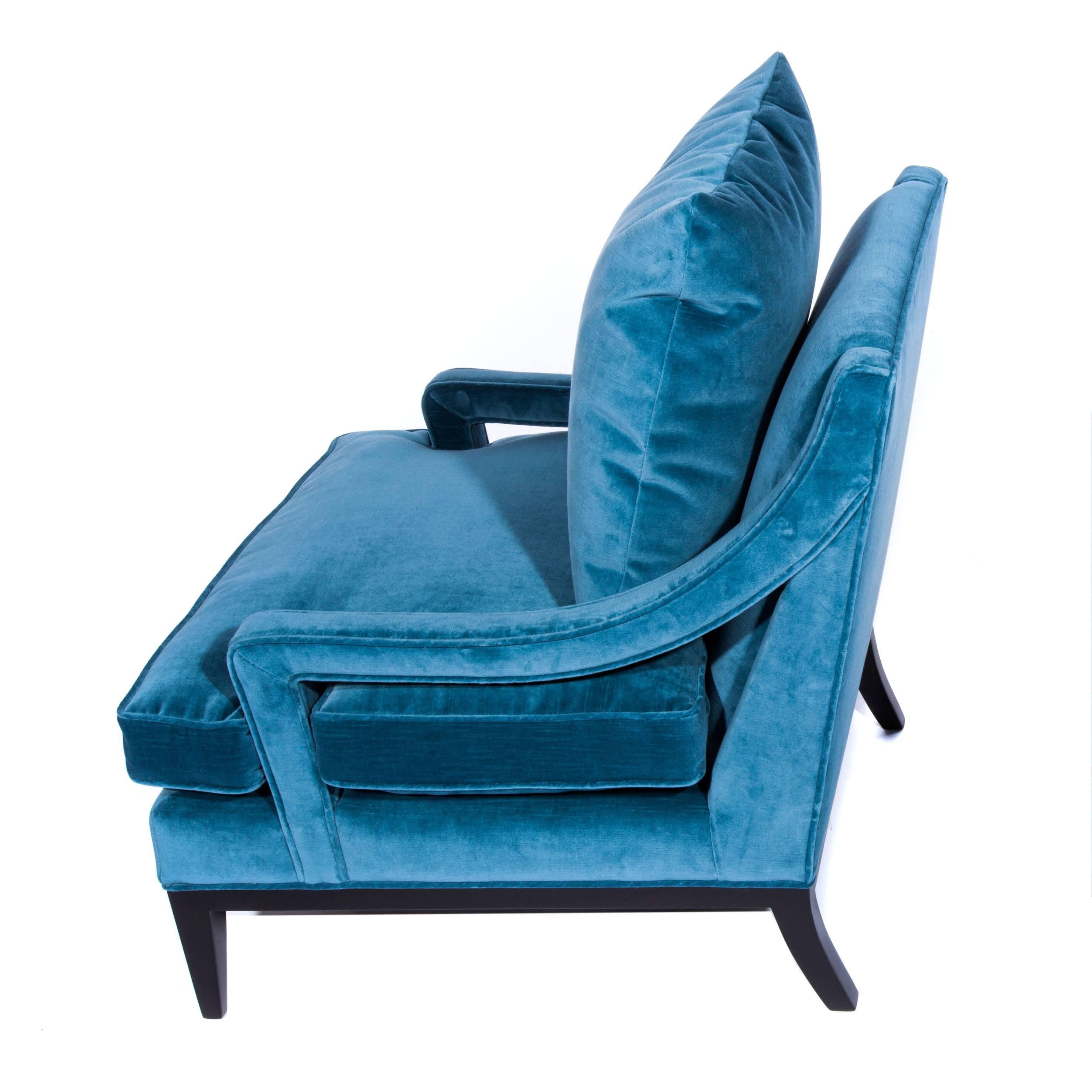 Beautifully scaled 1960s lounge chair with sloped, open-sided arms, supported by an ebonized-wood frame with tapered legs. Refinished and reupholstered in a rich blue cotton velvet with new foam. Includes optional matching feather-and-down back