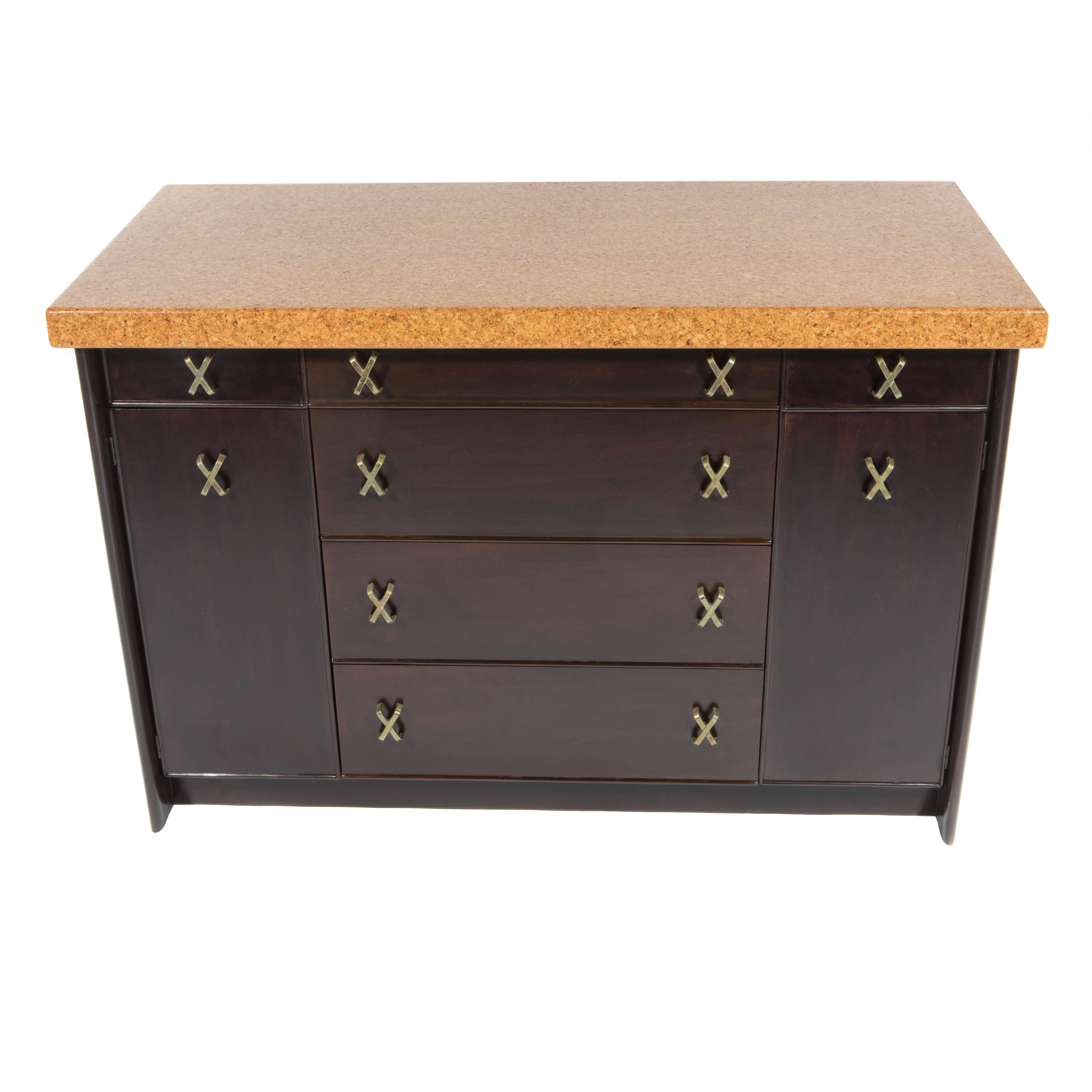 Versatile and beautifully made 1950s mahogany cabinet with Frankl's signature cork top and x-shaped brass pulls. In beautifully restored condition. Top drawer features felt-lined dividers for flatware. 

See this item in our Brooklyn showroom, 61