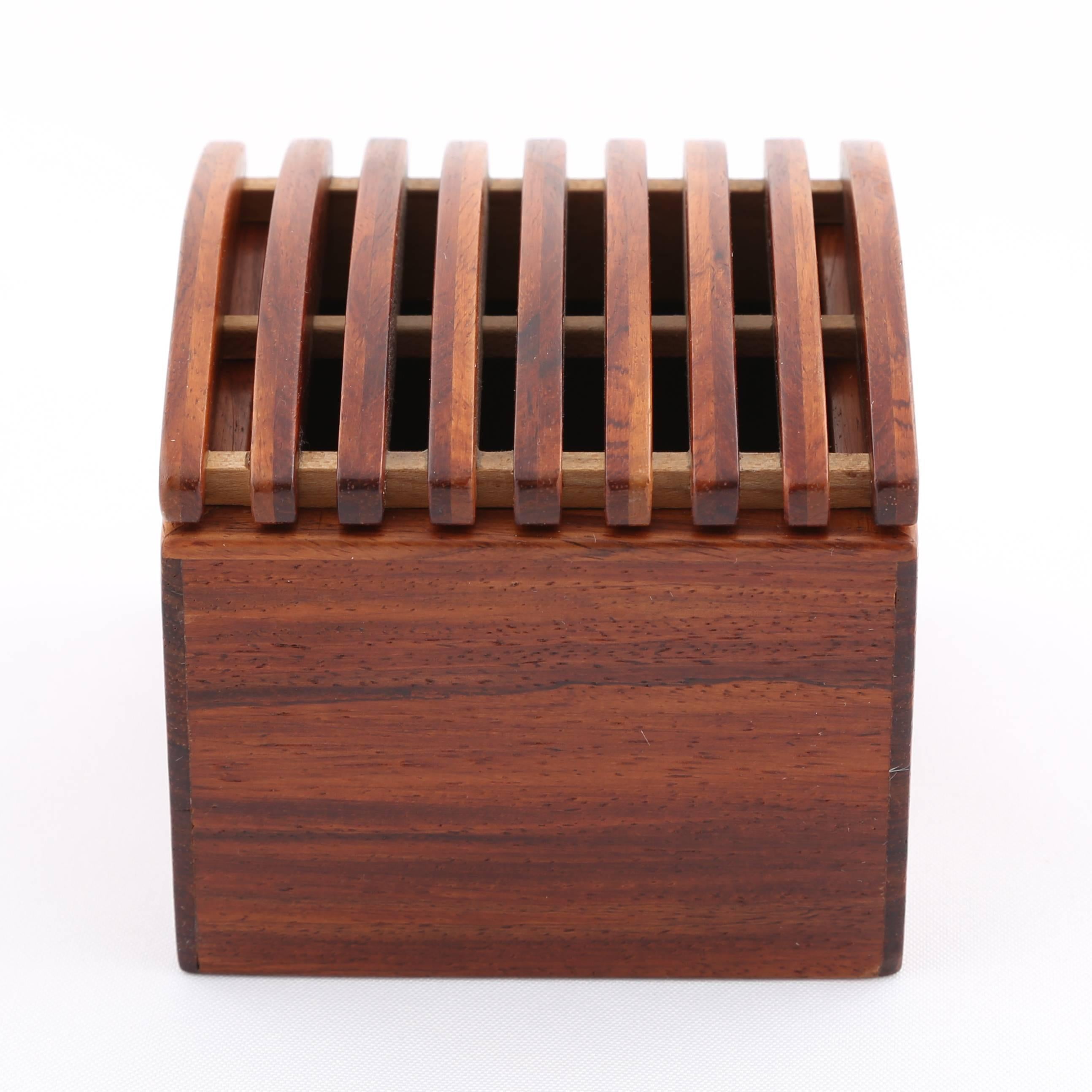 Lovely exotic wood box with gently arched, ribbed lid. Jerry Madrigale worked for Knoll's Design and Development division for many years and was in charge of prototyping anything made of wood or with wooden elements. We're offering four of