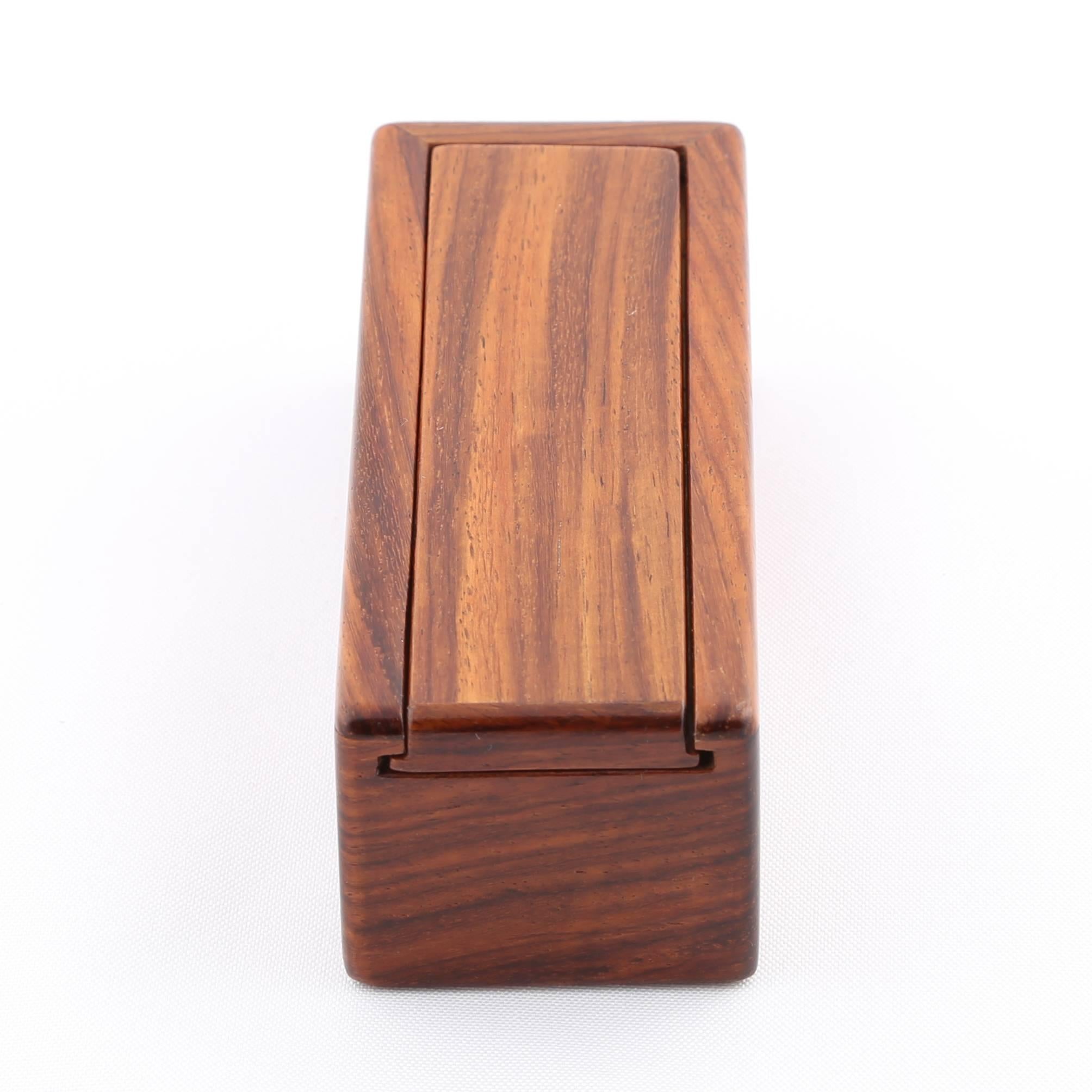 Lovely rectangular wooden box with sliding lid. Jerry Madrigale worked for Knoll's Design and Development division for many years and was in charge of prototyping anything made of wood or with wooden elements. We're offering four of Madrigale's