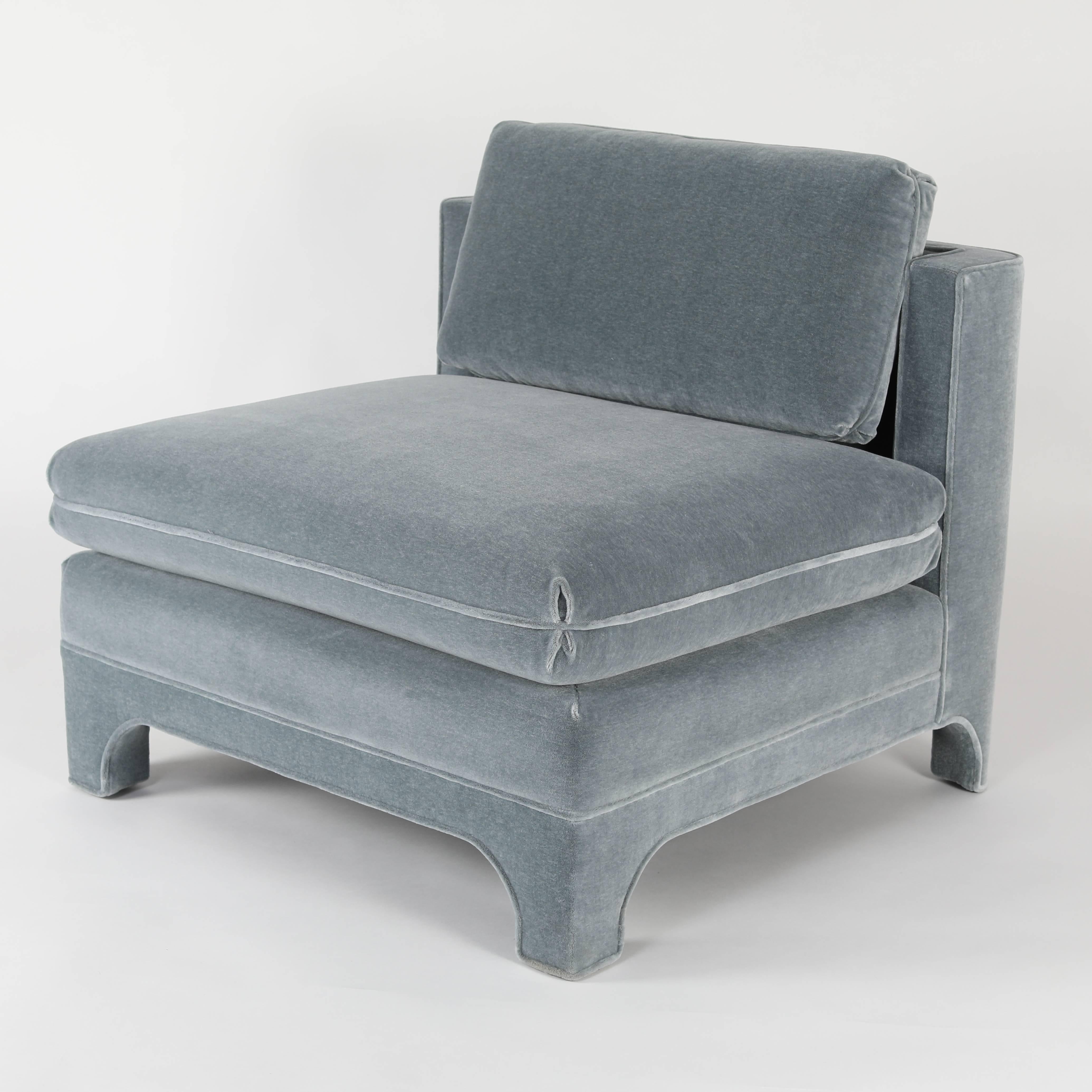 These large and comfortable chairs have been beautifully restored in a cool, medium-blue mohair with a touch of grey. Fully upholstered with simple lines and just the right amount of detail, including arched feet and a notched back that accommodates