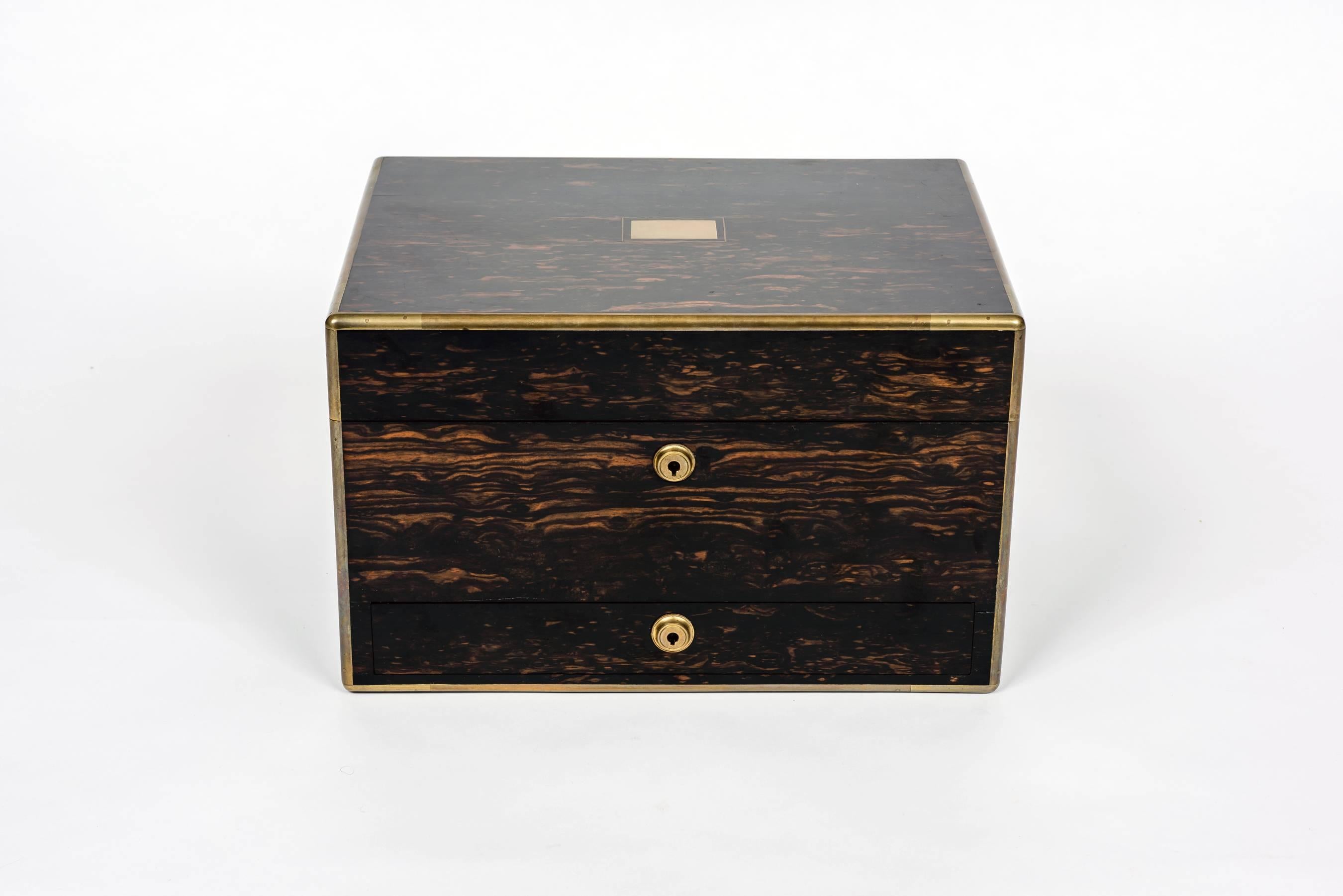 An immaculate and exquisite Mid Victorian Coromandel wood dressing case. The finely figured box with brass edging mounts and Bramah locks. The gilded interior hinges and lock beautifully engraved and with engraved plaque I and W Wood 14 King Street
