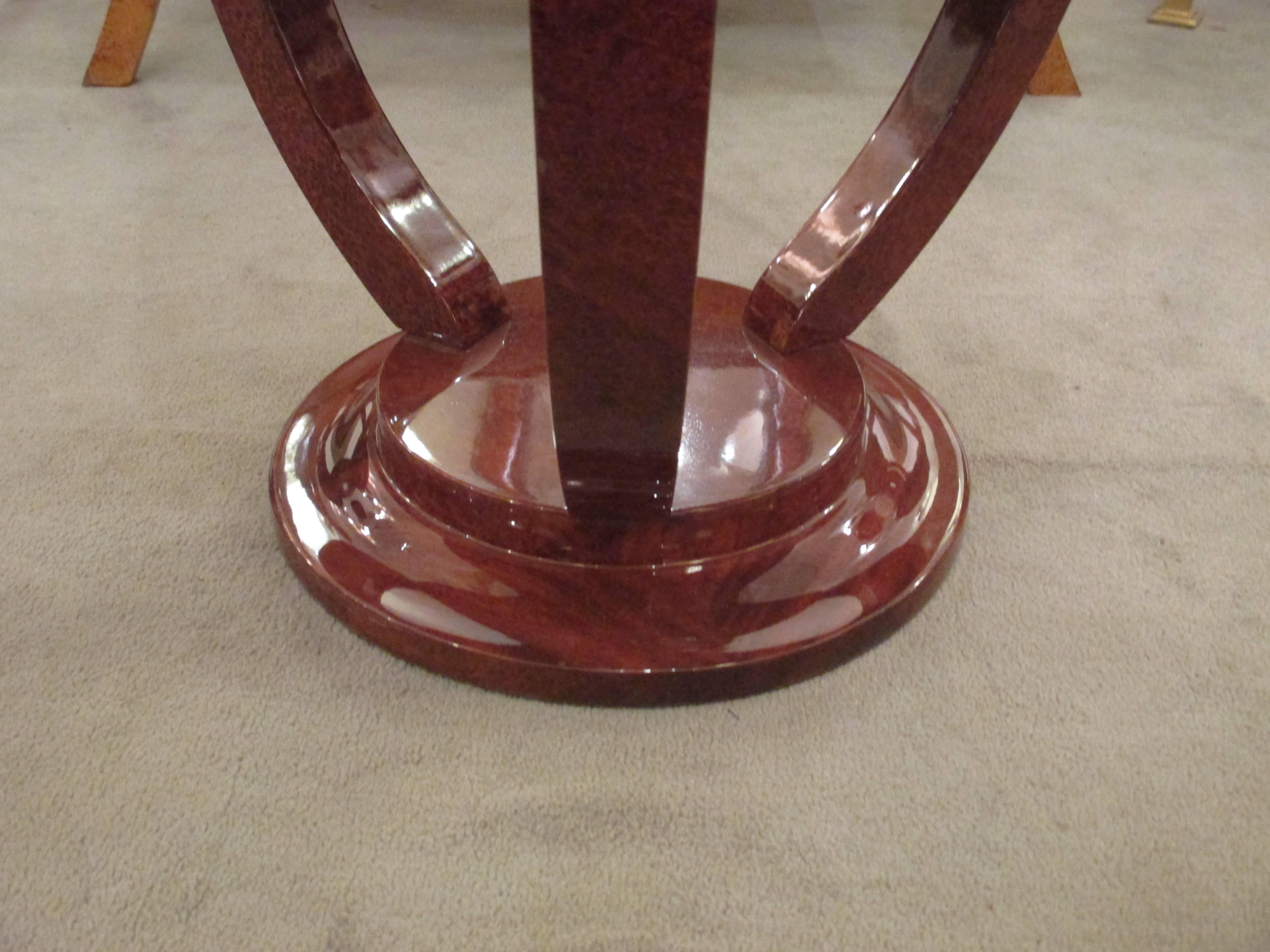 An Art Deco two-tier round side table.
Amboyna.
