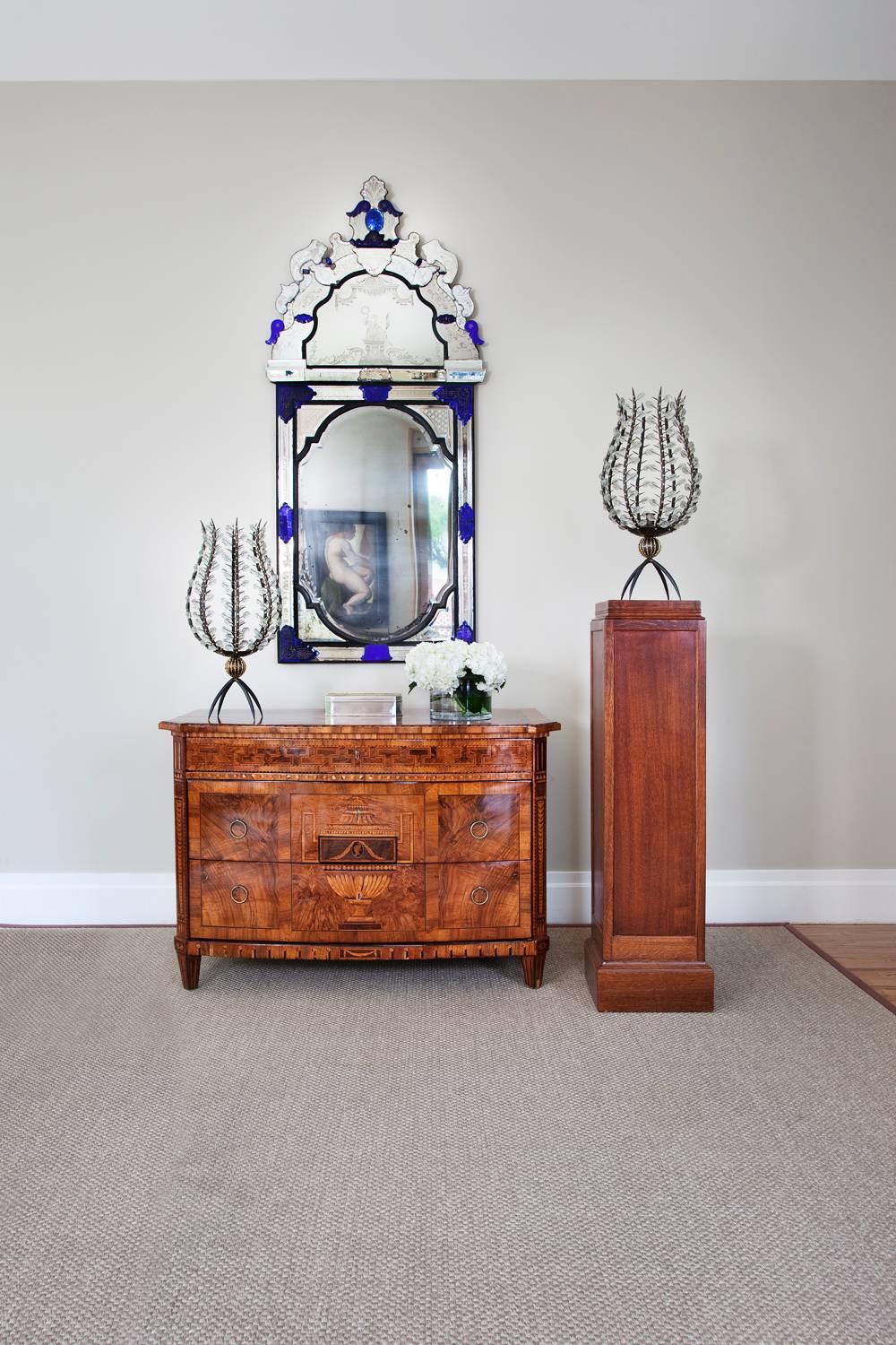 An important Baltic multifaceted mirror.
Finely etched and bevelled mirror facets,
surround the central bevelled mirror and upper pediment,
with beautiful bevelled and etched accents in,
brilliant cobalt blue glass.
