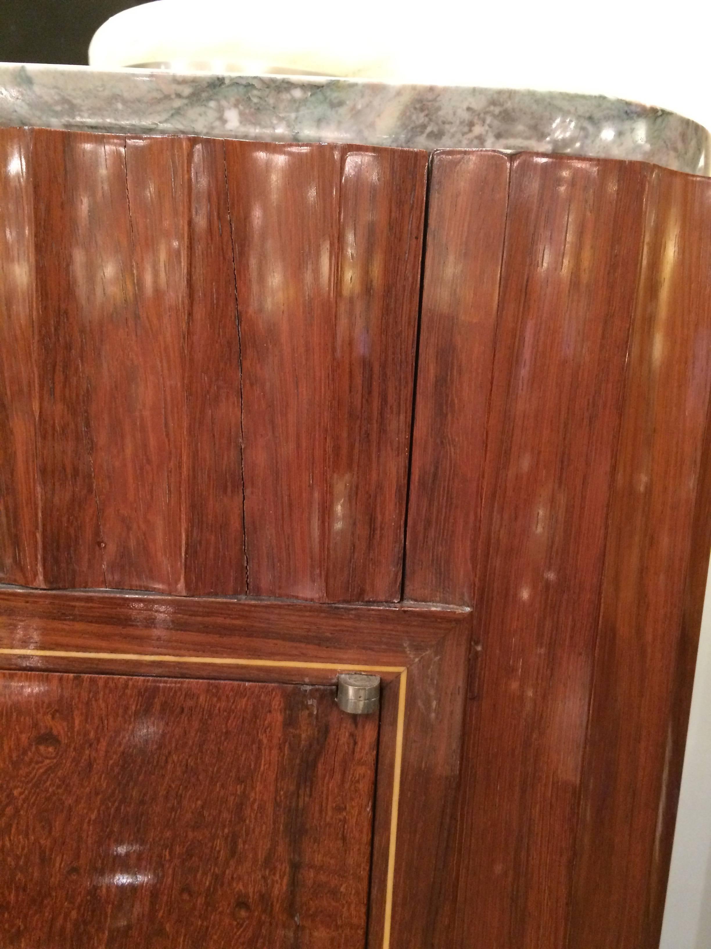 A fine Art Deco sideboard designed by Mercier Frères.
Mahogany with fruitwood inlay details, marble top,
patinated bronze pulls and sabots.