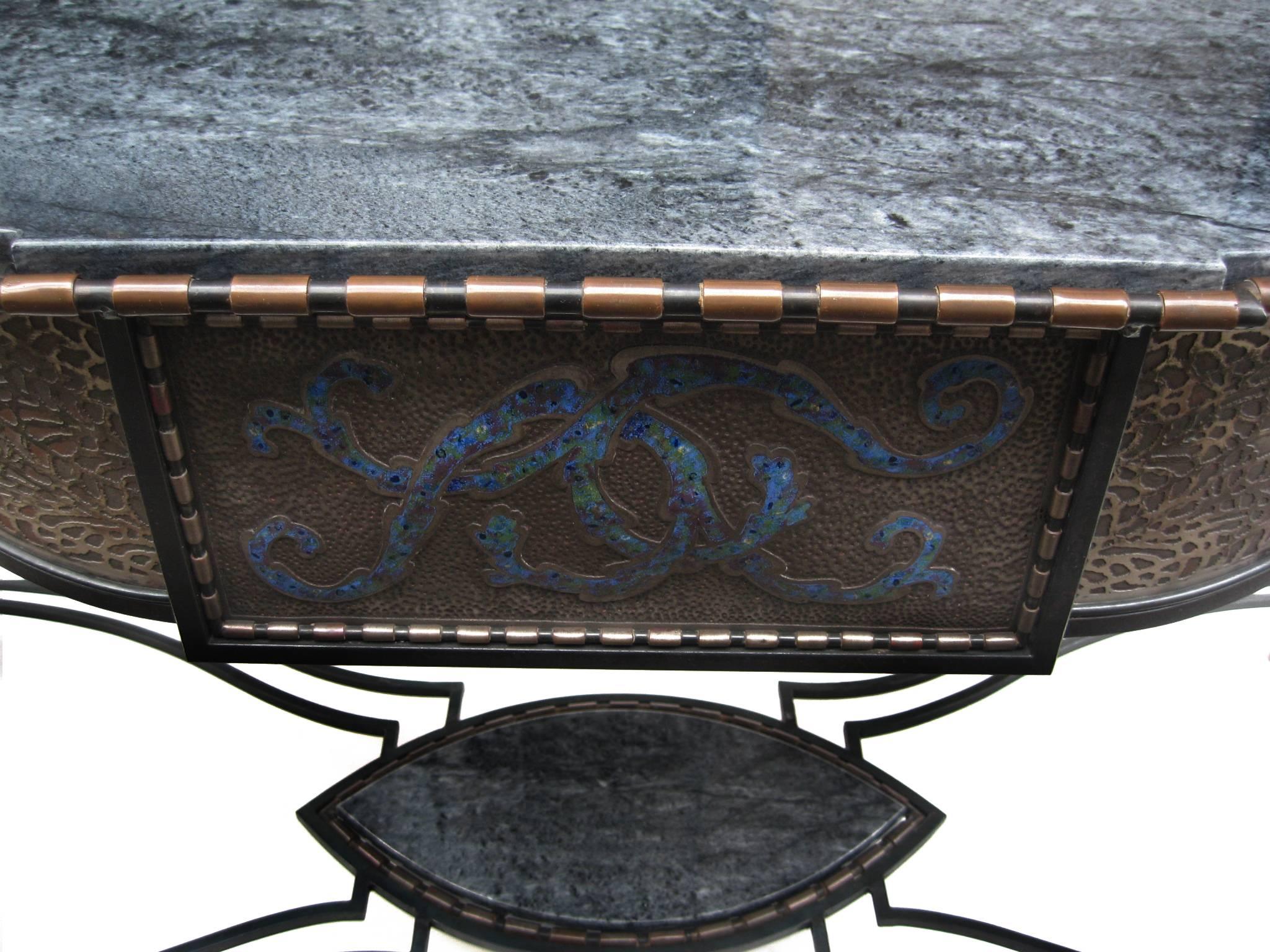 A rare and unusual bow front console. 
Designed by André Dubreuil.
Crafted in wrought iron and bronze 
with enameled details in shades of blue
and a marble top.
Limited Edition of six. 
France 
André Dubreuil (French, 1951 -) is a leading