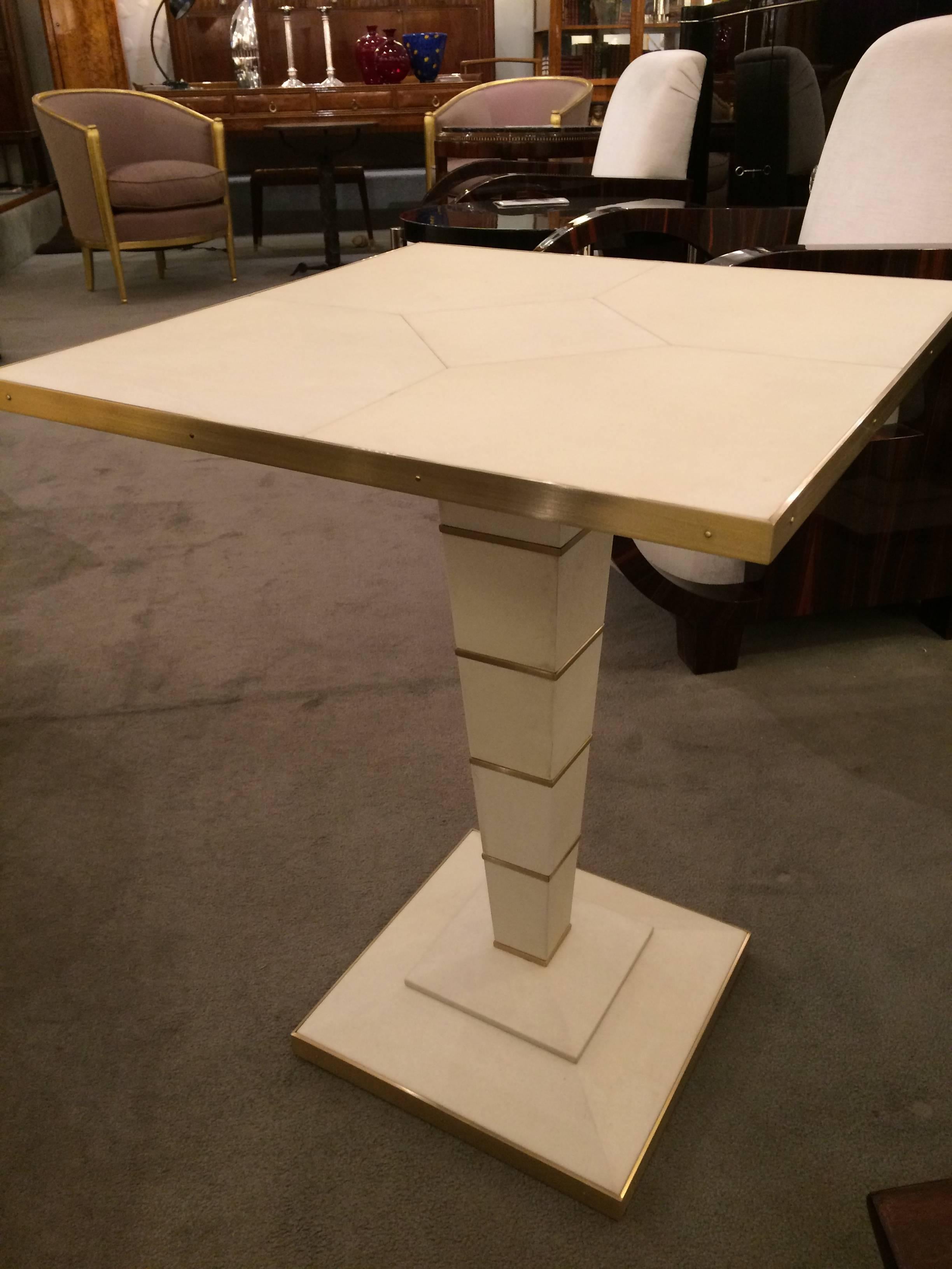 A fine Modernist parchment side table. 
Designed expressly for Karl Kemp Contemporary Collection.
Parchment and patinated brass.
Additional table available.