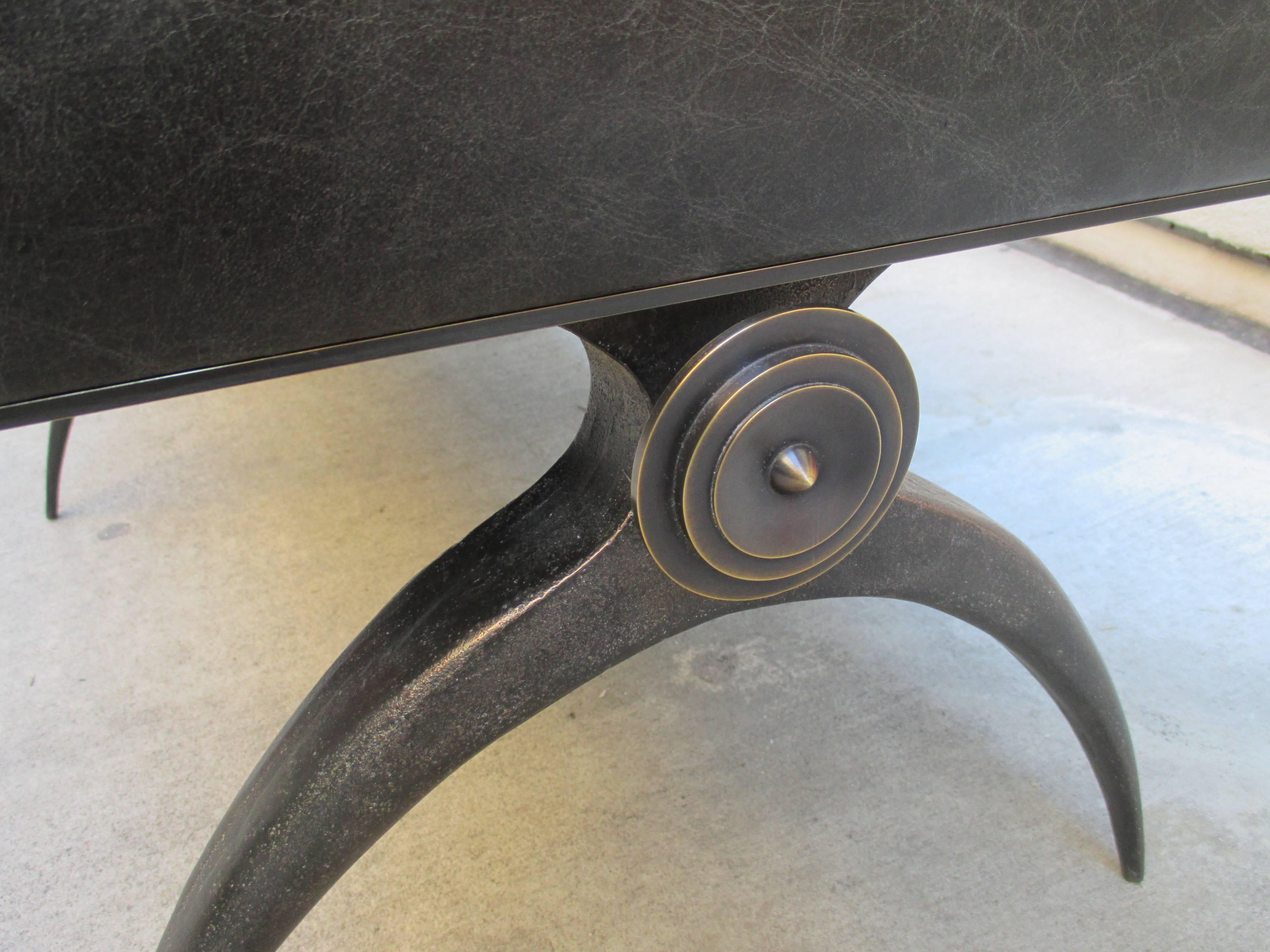 A fine modernist bench in solid bronze.
Leather upholstery and supported by
six solid bronze 