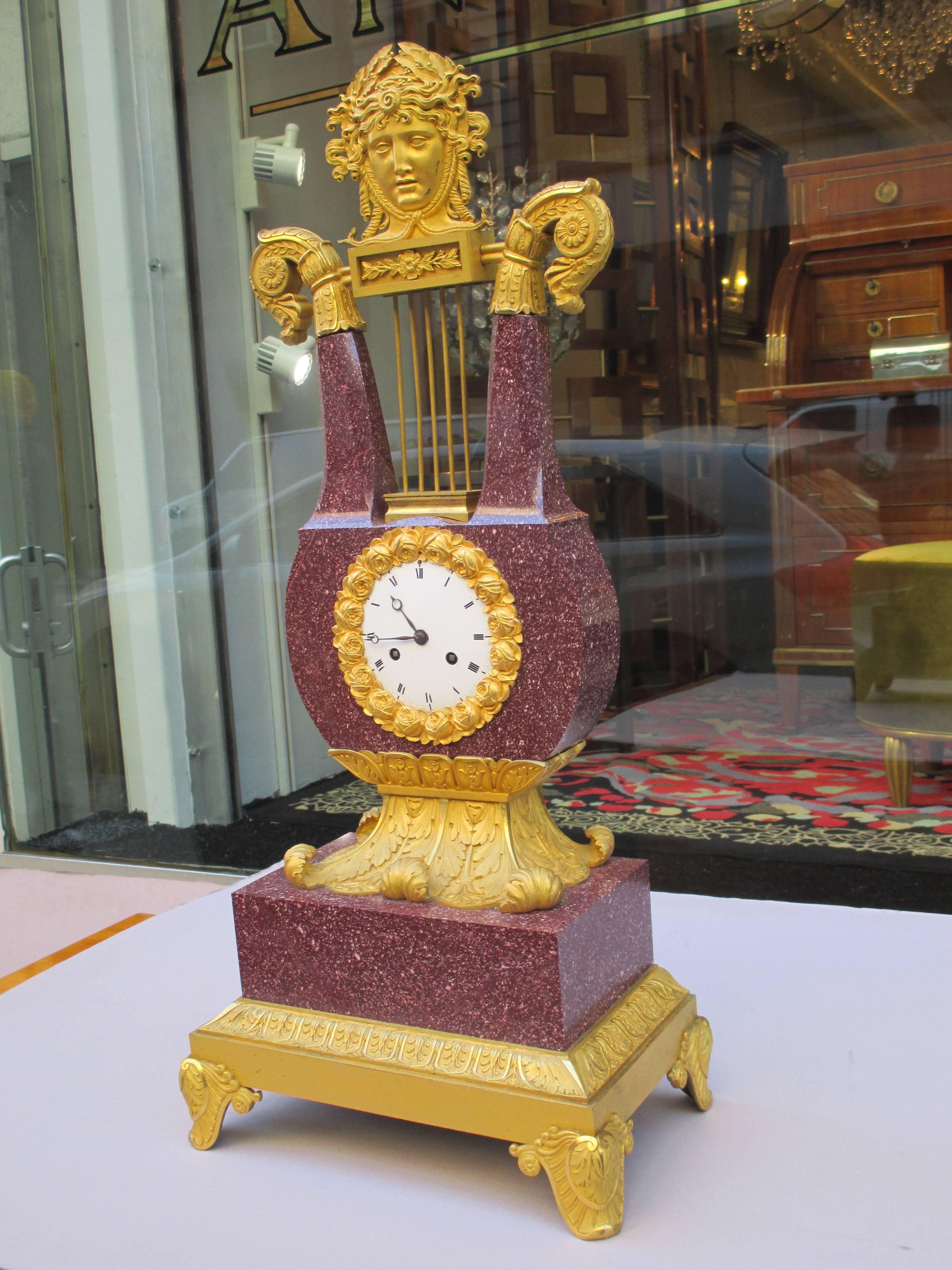 An important Charles X imperial porphyry lyre clock.
Crafted from red porphyry and ormolu.
Movement signed and dated 1828.
 
Clockworks have been cleaned and restored to proper working condition.
 