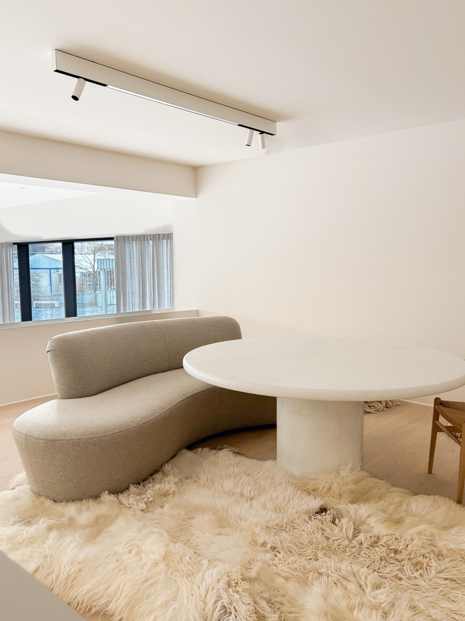 The Eclipse Sofa by am designs is a bold, sculptural statement piece that merges comfort with contemporary design. Handmade in Belgium with fixed upholstery, its organic curves and rounded volumes evoke a sense of softness and fluidity, bringing