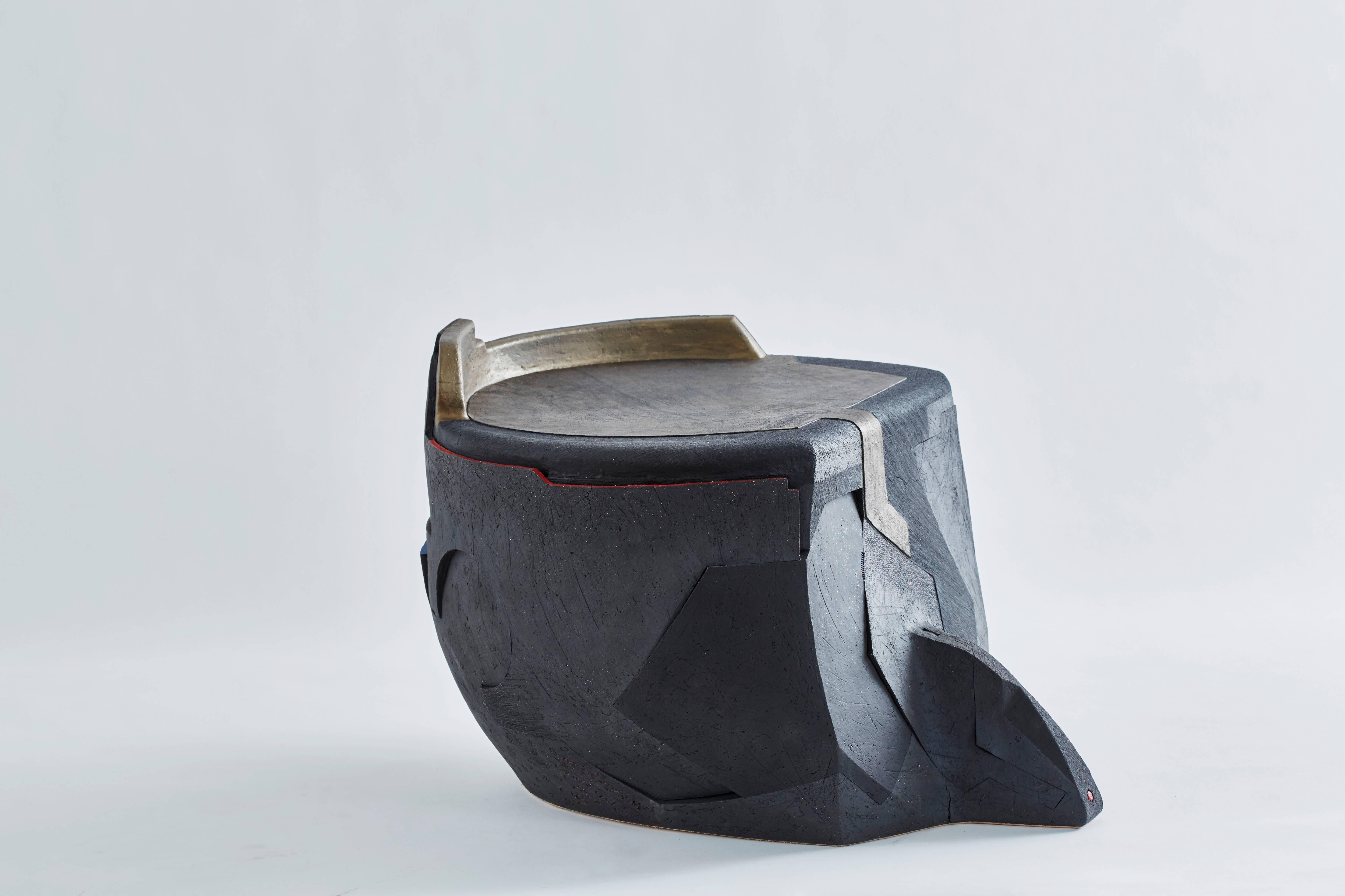 Andile Dyalvane [South African, b. 1978]
Soze Nyanga (Mud Table/Stool), 2015
Black clay
Measures: 19 x 30 x 23.25 inches
48.5 x 76 x 59 cm
Signed: M Dyalvane 2015 CAMA Gu

Andile Dyalvane was born in Ngobozana, a small village in the Eastern Cape