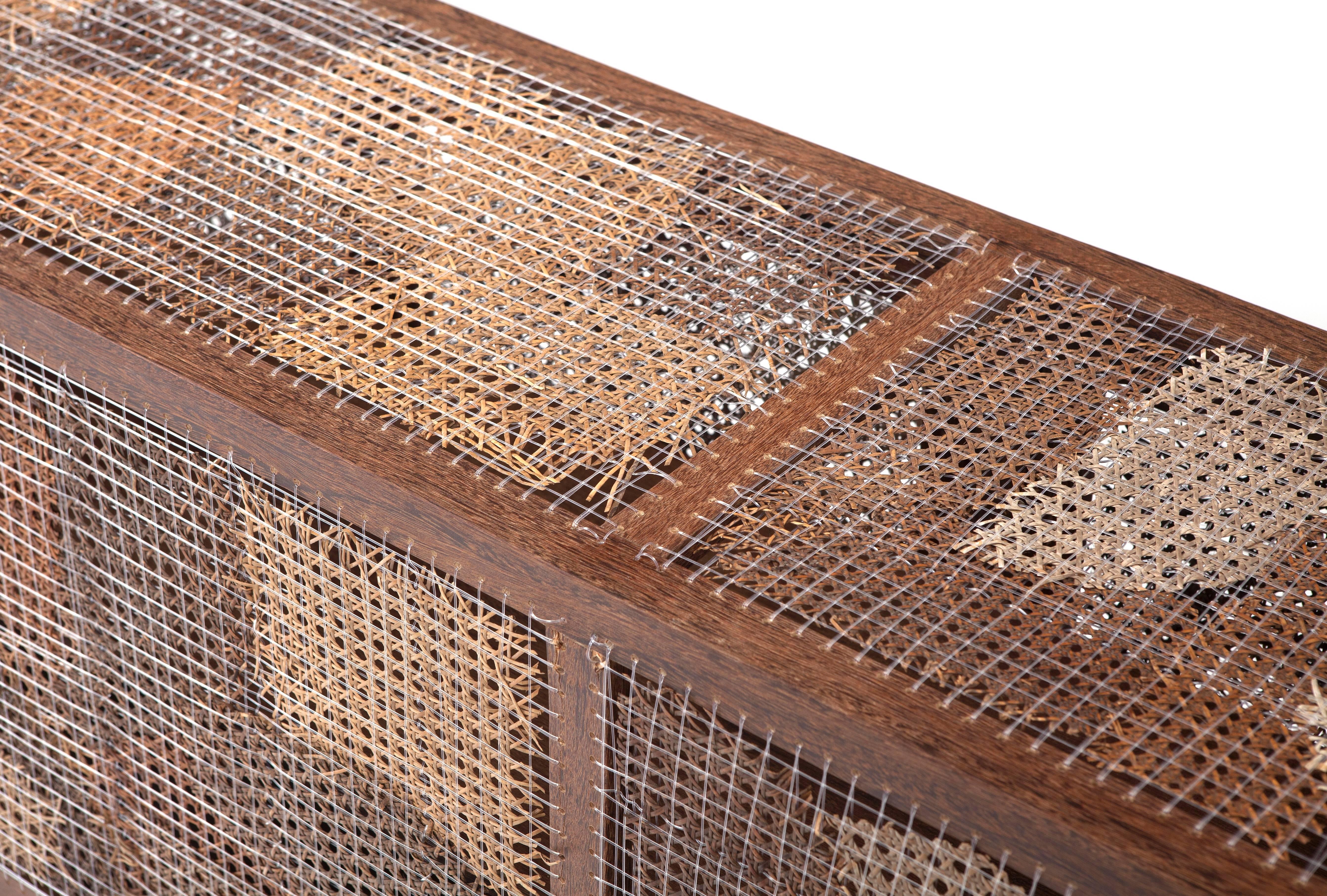 Brazilian design duo and brother Fernando and Humberto Campana created this Thonet wicker, woven nylon and sucupira wood buffet from reclaimed/recycled materials.

The Campana Brothers, Fernando (b. 1961) and Humberto (b. 1953) were born in