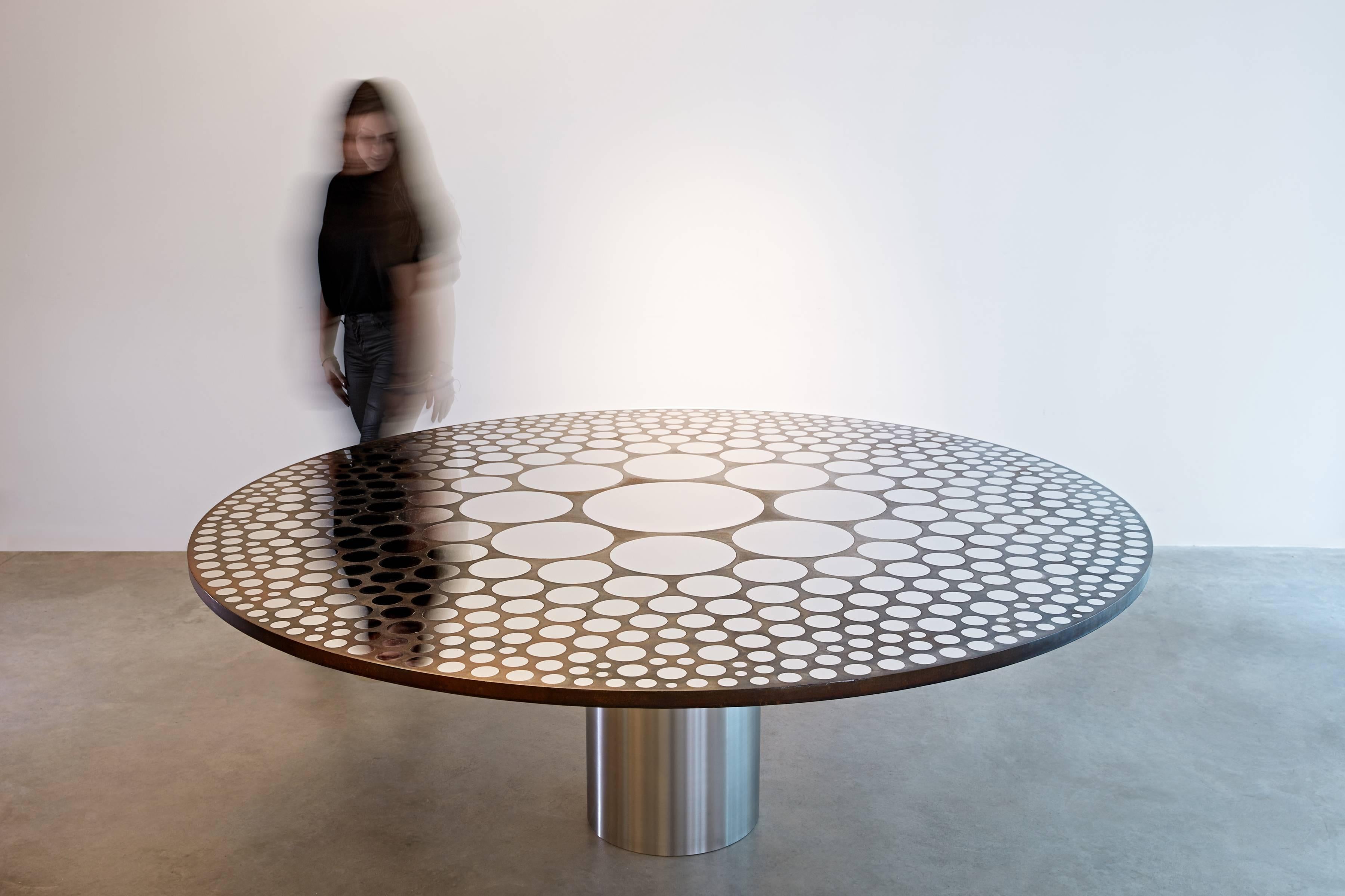 Stainless steel and mild steel freeze multi circle table by British designer Paul Cocksedge.

London-based designer Paul Cocksedge attended Sheffield Hallam University, receiving a BFA in Industrial Design. He later returned to London to study under