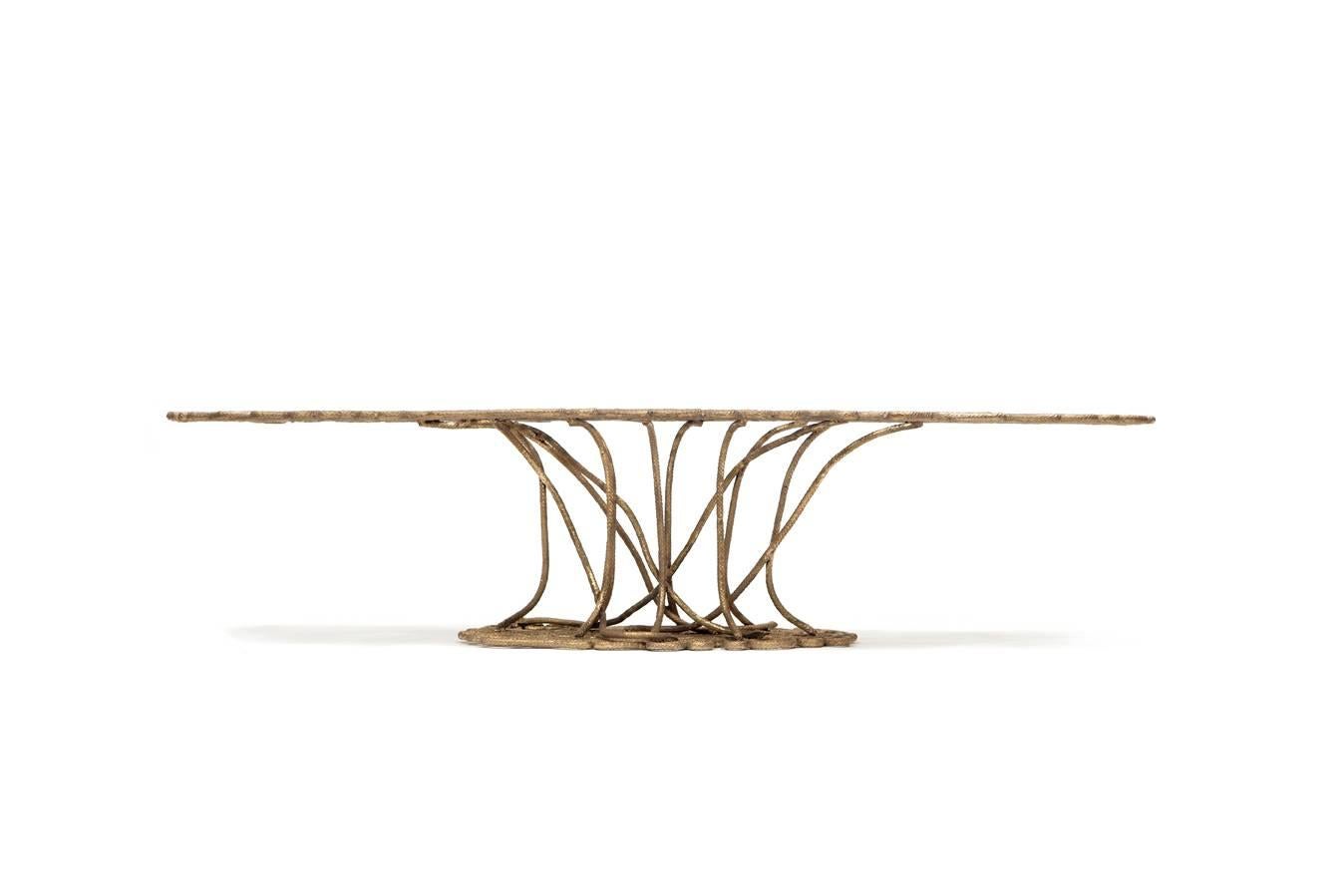 Ofidia Center Table, 2015
Cast bronze
13.78 x 57.09 x 29.53 inches
35 x 145 x 75 cm
Signed and numbered

The Brazilian designers Fernando and Humberto Campana created this bronze coffee table, cast to look like rope.

The Campana Brothers, Fernando