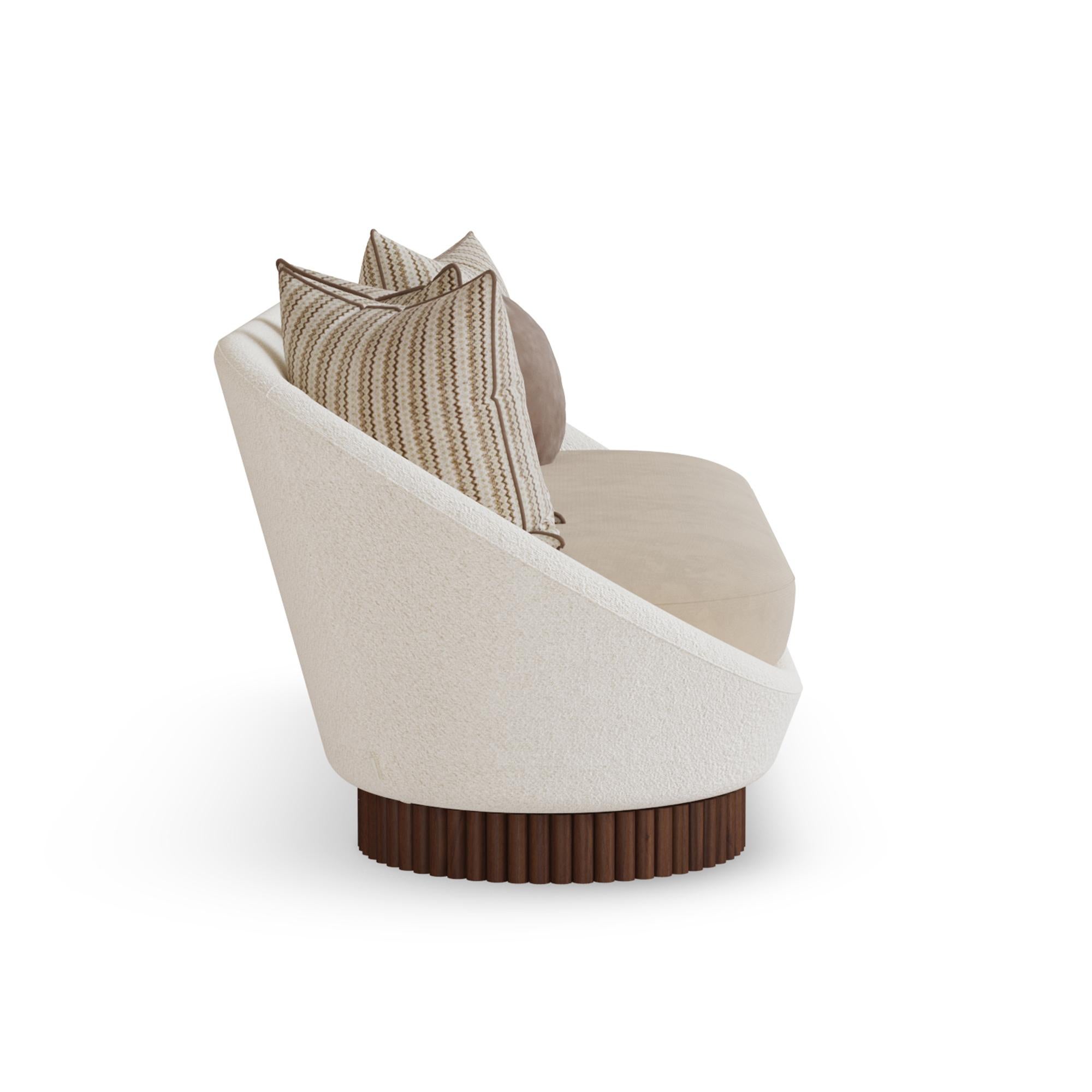 Anki Sofa combines modern elegance with exceptional comfort, continuing the refined design language of the Anki family. Featuring a gently curved silhouette, the sofa not only captivates with its streamlined form but also embraces its users in soft,