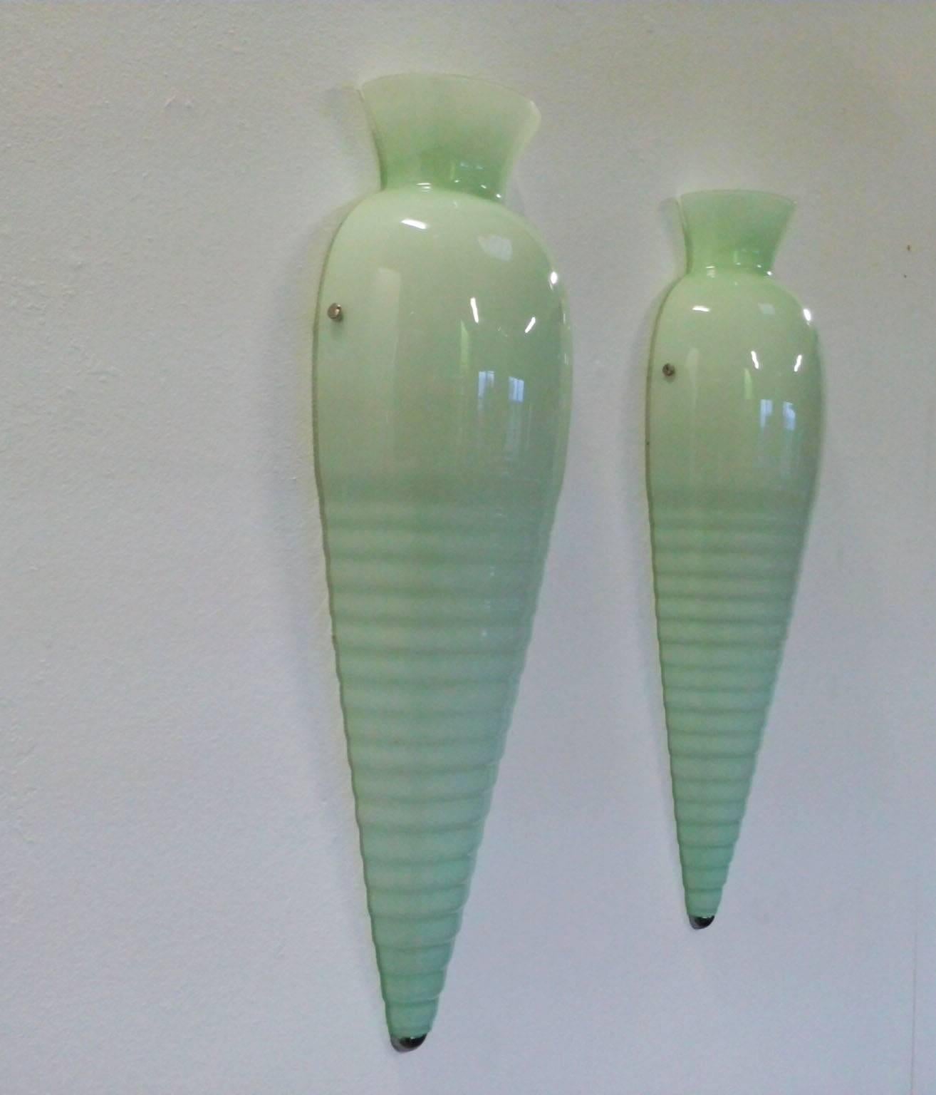 A pair wall of sconces by Venini 1970, mark of the company on the frame, white laquered metal frame with blown and layered glass in soft green color, final chrome tip and screws to fix the glass....the lot is composed of 20 pieces available by pair.