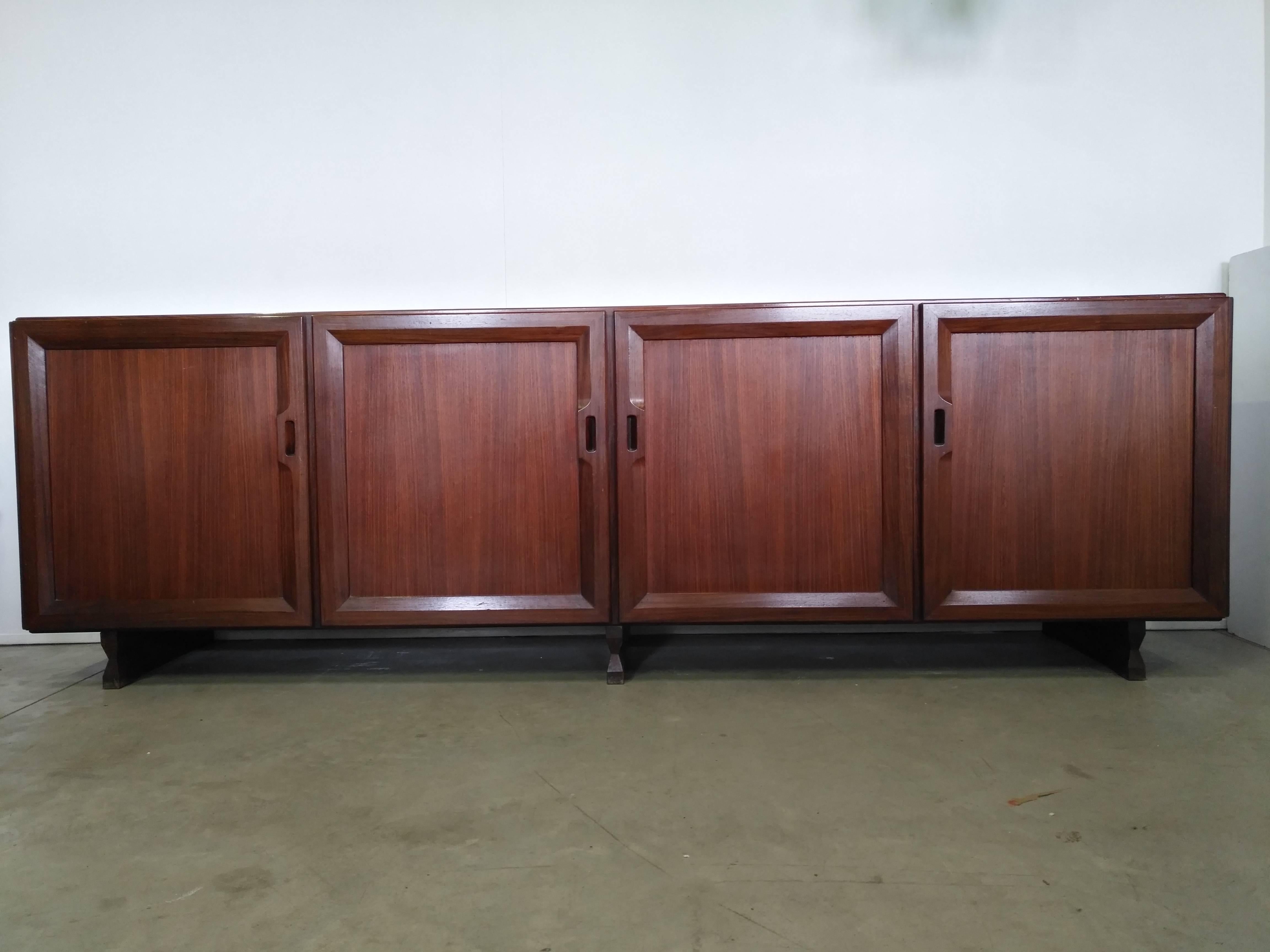 Beautiful sideboard four doors, mahogany wood, designed by Franco Albini in 1957 and manufactured by Poggi this credenza is called ‘MB15’. 
Original in all parts is very elegant and modern style even if was made in the 1950s, really an icon of the
