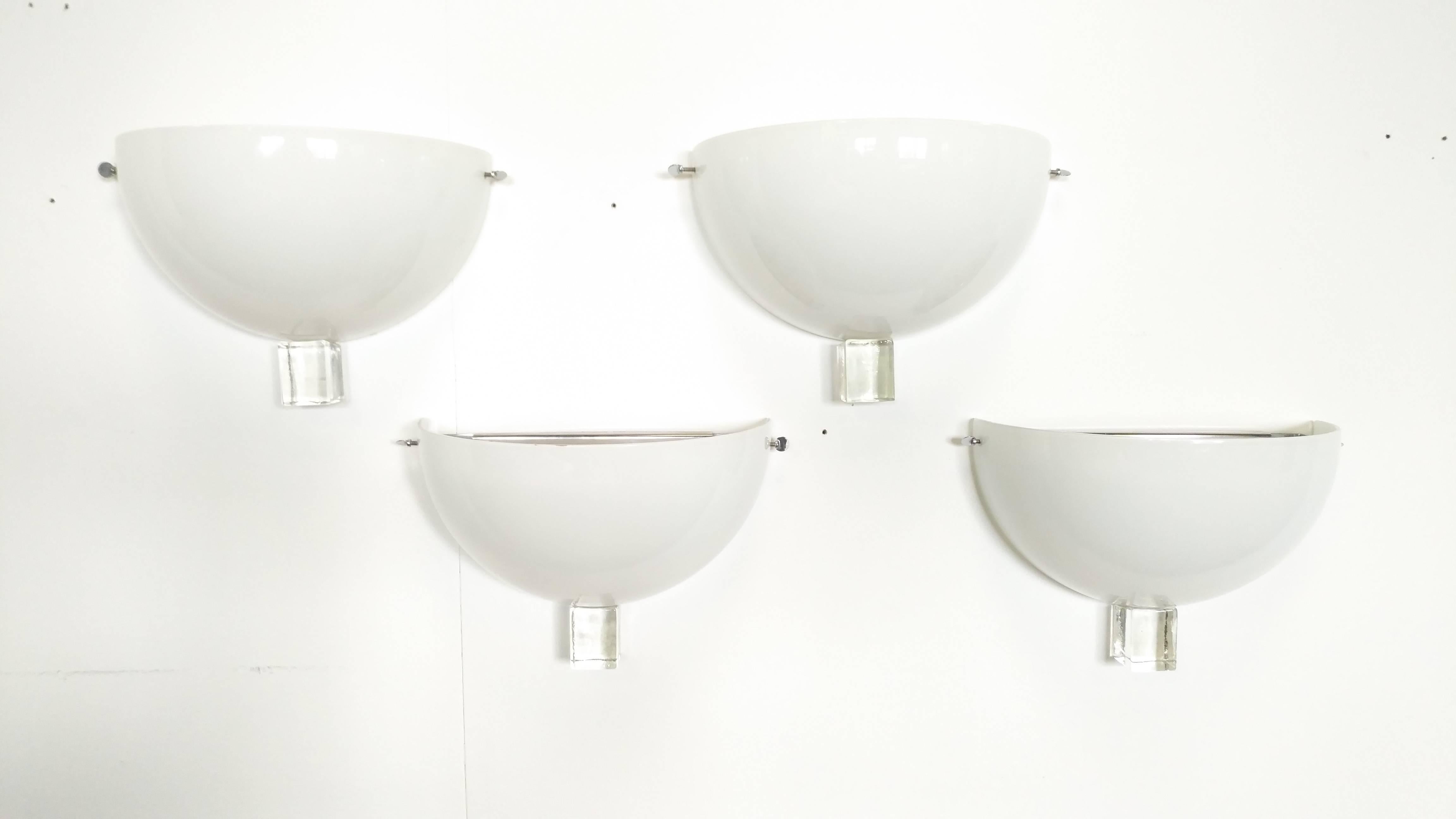 Set of four sconces by Venini , 1987, white opaline glass and metal structure, signed at the cube glass base.