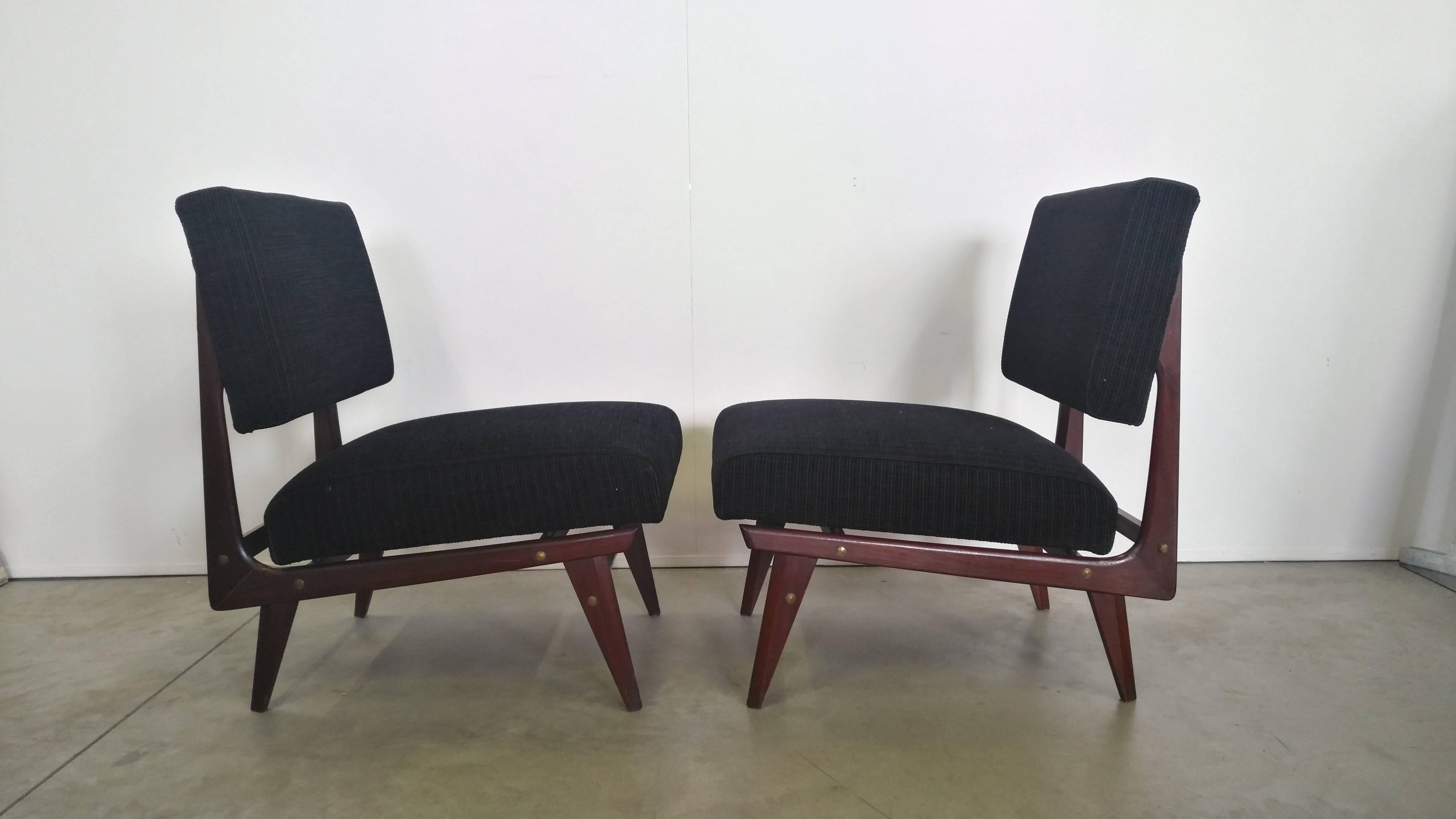 Beautiful armchairs with mahogany wood frame linked to the seat by brass custom junctions, black velvet new upholstery
manufactured in 1950 by the company Dassi Lissone.