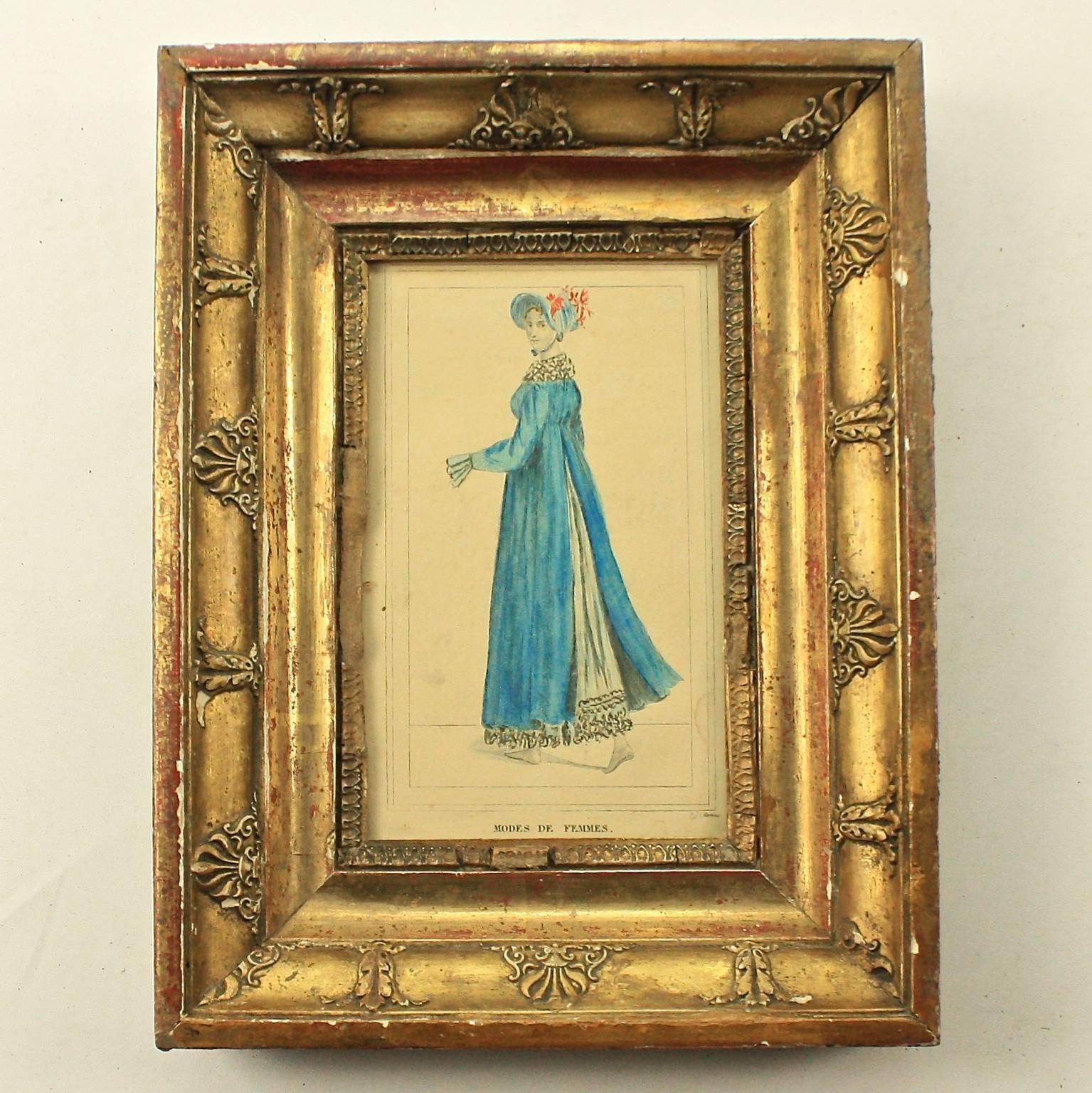 Set of four giltwood framed hand coloured fashion plates of two 'Modes d'Hommes' and two 'Modes de Femmes'. Fashion plates are 19th century images of the latest trends in clothing, accessories, and even hairstyles. Our plates were published by