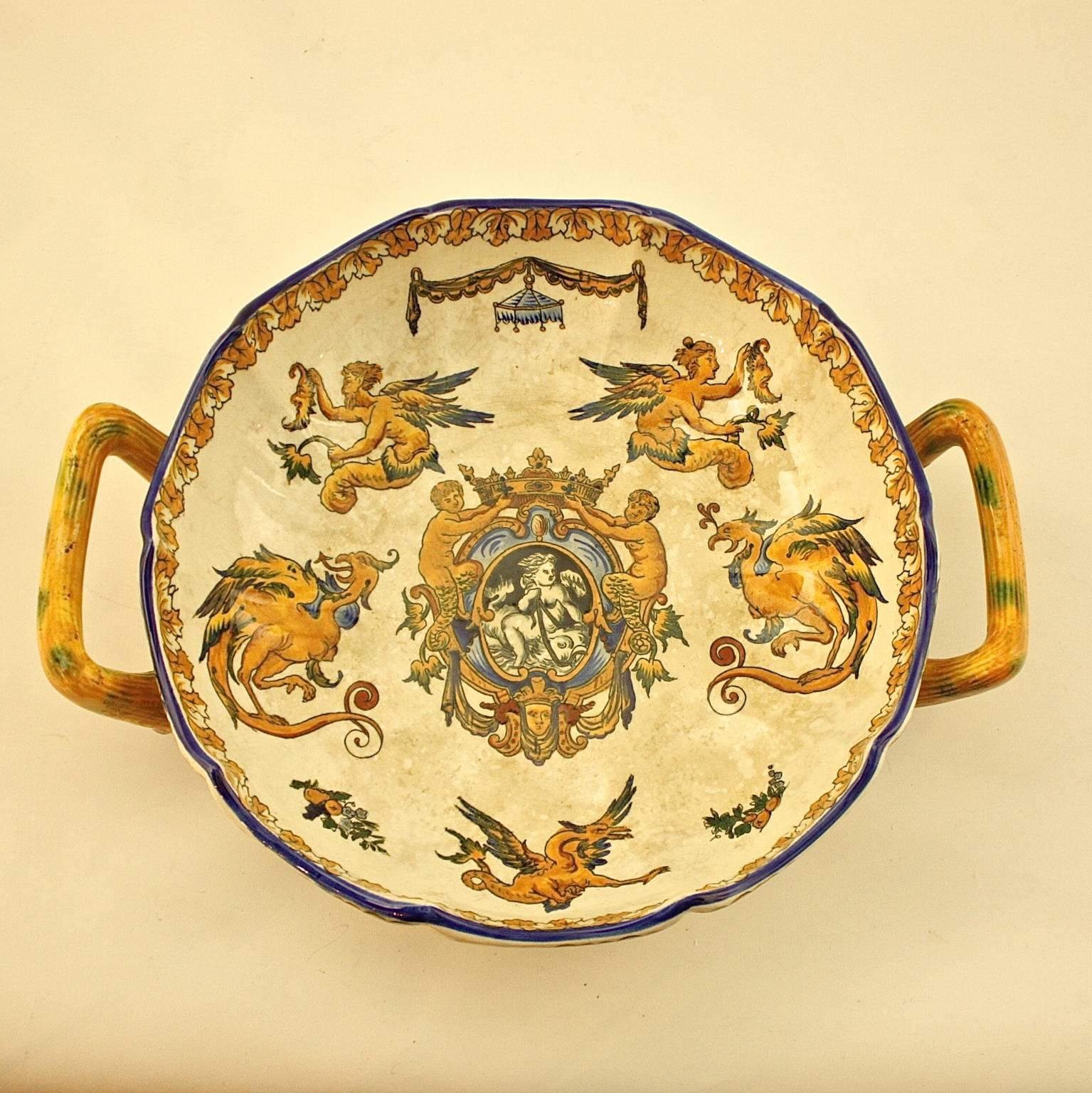 A lead-glazed yellow earthenware two-handled bowl of the Faiencerie de Gien. Gien was founded in 1821 by Thomas Hall, and Englishman who wanted to introduce fine English earthenware manufacturing techniques in France. Gien specialized in traditional