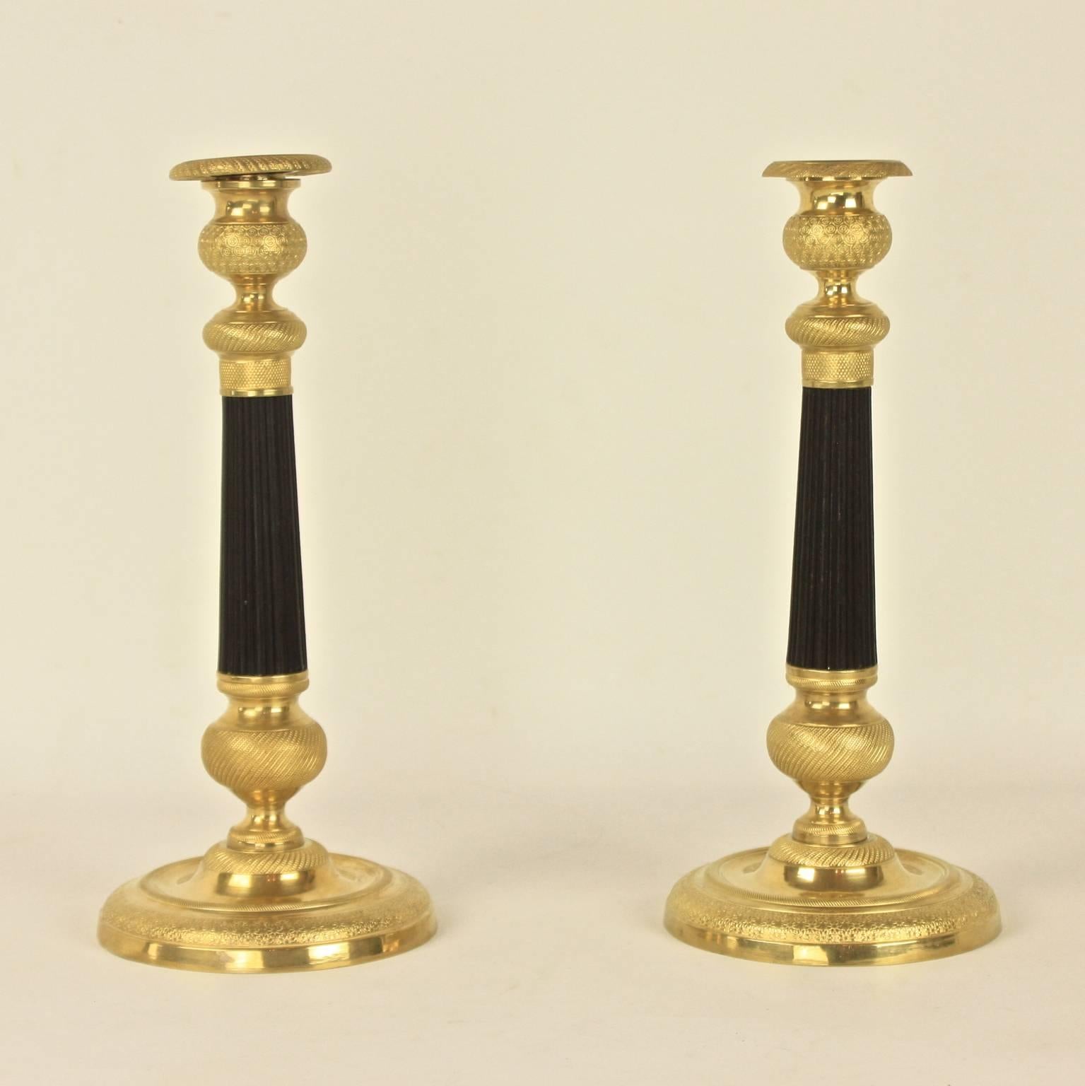 Pair of Charles X-Patinated and Gilt Bronze Candlesticks 1