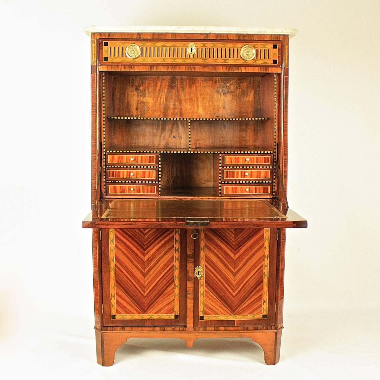 A 18th century Louis XVI drop-front secretaire (secrétaire à abattant), attributed to the menusier François-Noël Geny (1731-1804, maitre 1773) from Lyon.

The writing cabinet veneered in kingwood and tulipwood on a ground of pine. The top of