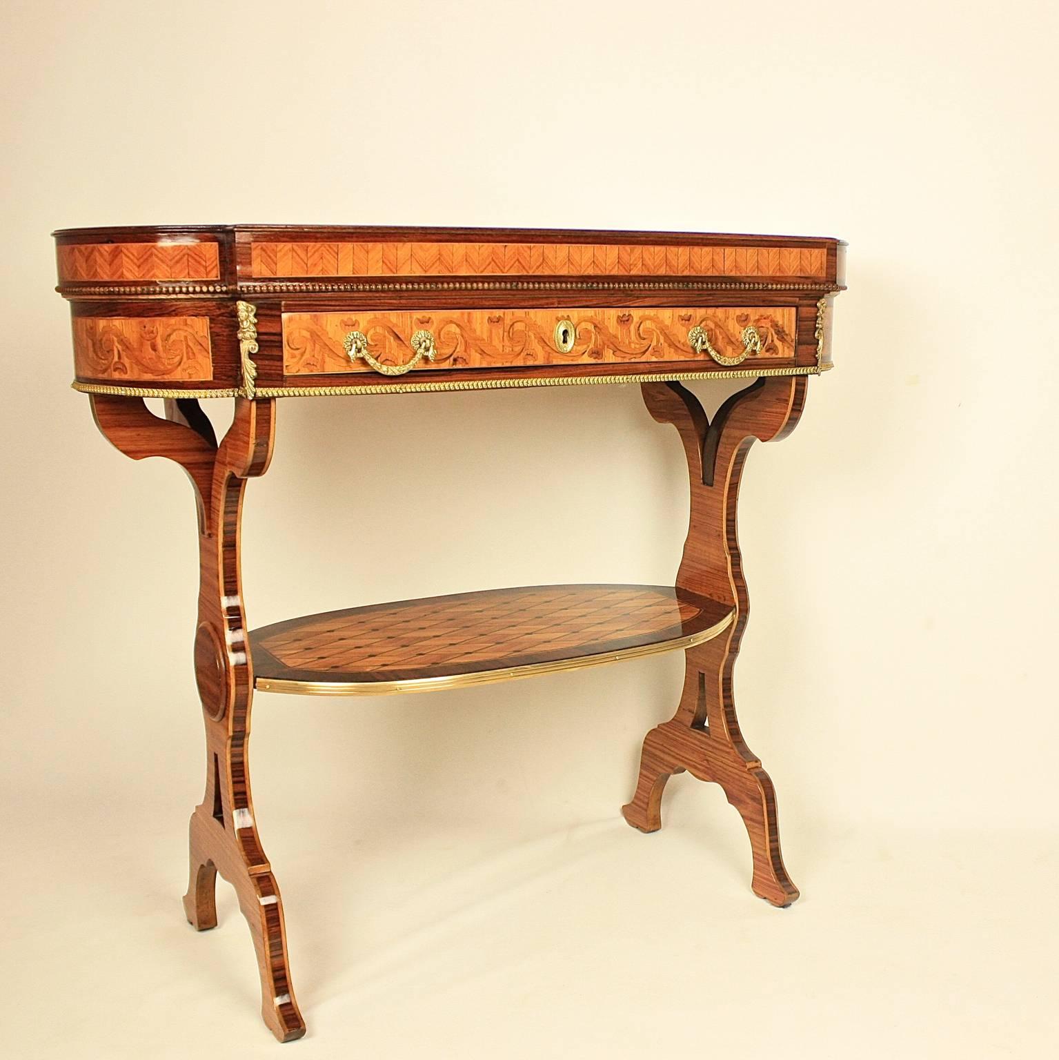 A magnificent 19th century marquetry oval side table based on a design by J. H. Riesener (1734-1806.) A remarkably similar oval side table was only recently pictured at Buckingham Palace when Theresa May was formally appointed Britain's prime