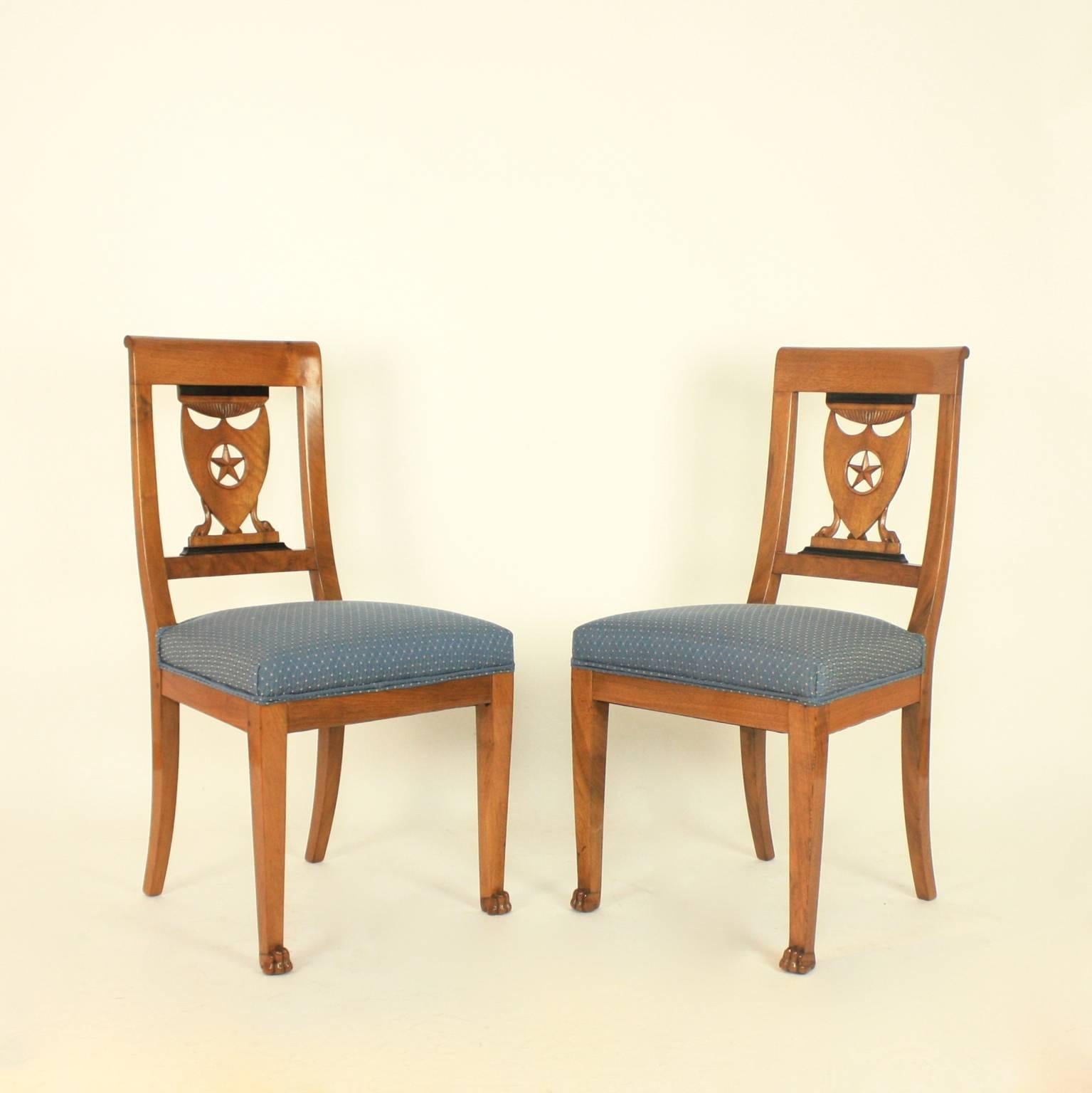 A set of six late 18th century Directoire beechwood side chairs from the workshop of Pierre Marie Balny (died 1832) in the manner of Henri Jacob (1753-1824.) 
With wide curved crest rails above a flat pierced lattice backs featuring a shield (a