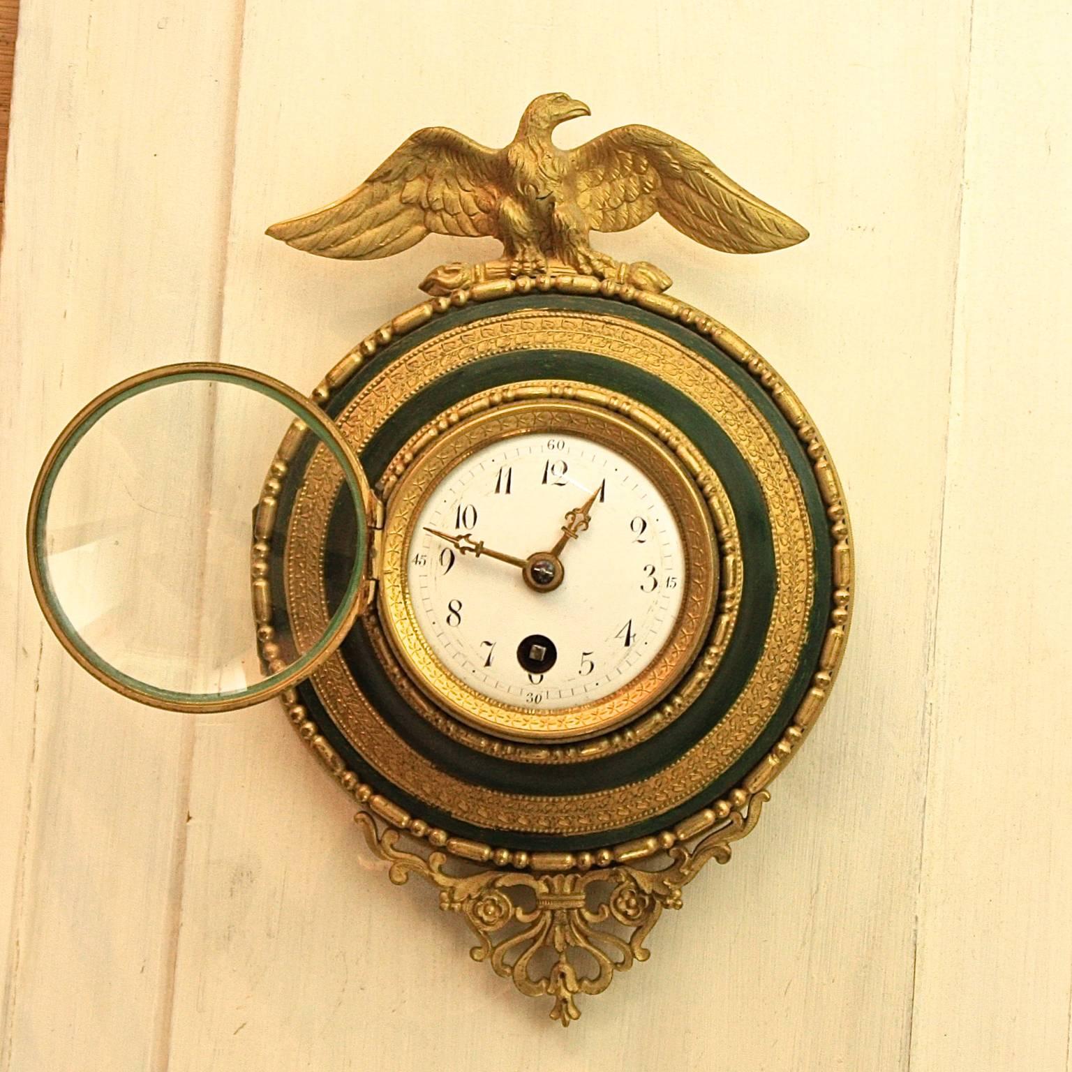 A small 19th century alcove wall clock, a 'pendules d'alcove' that was usually hanging in an alcove above a bed. The repeating mechanisms that chimed the nearest hour and quarter hour when a string was pulled eliminated the need to light a candle to