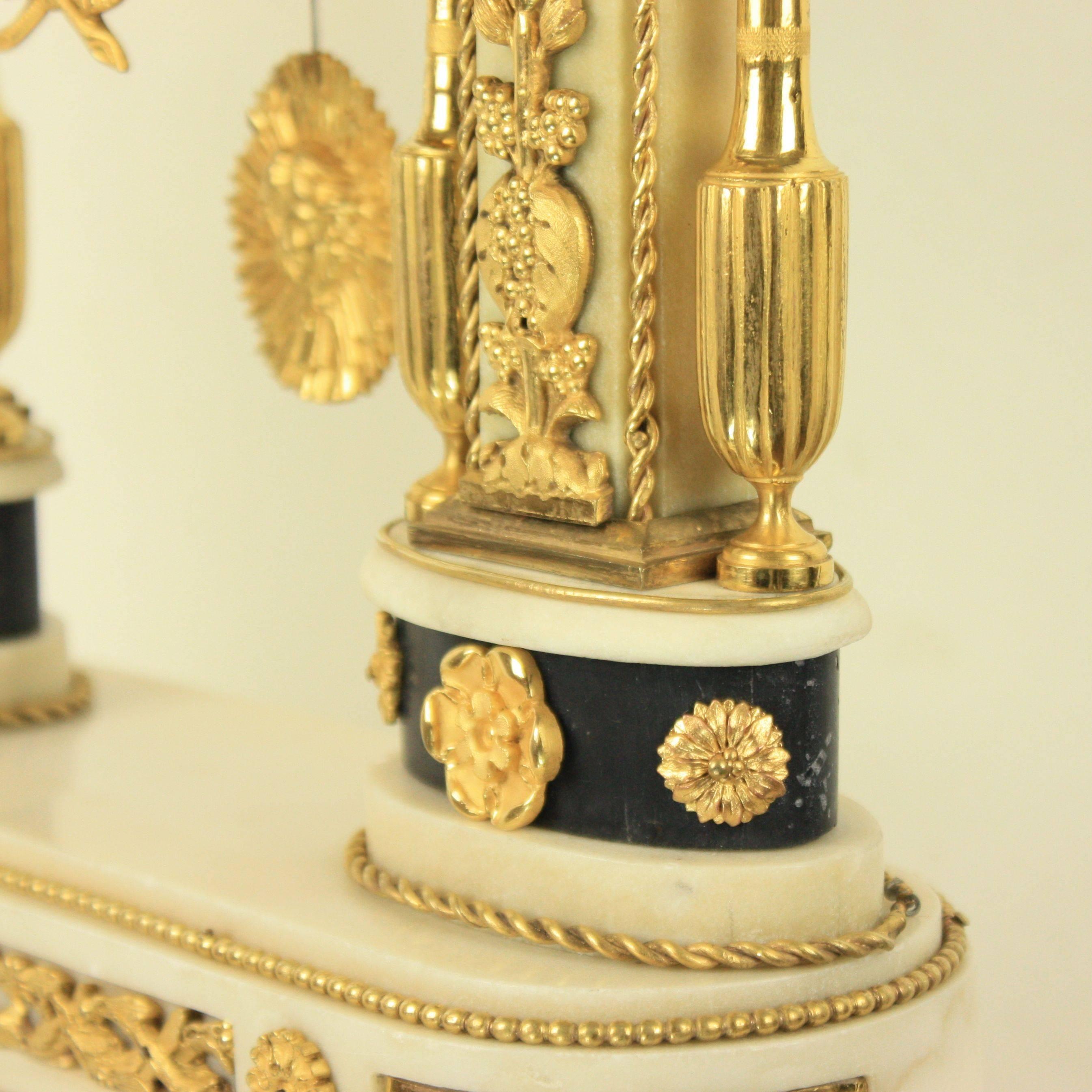 French Late 18th Century Louis XVI Carrara and Black Marble Ormolu Portico Mantle Clock