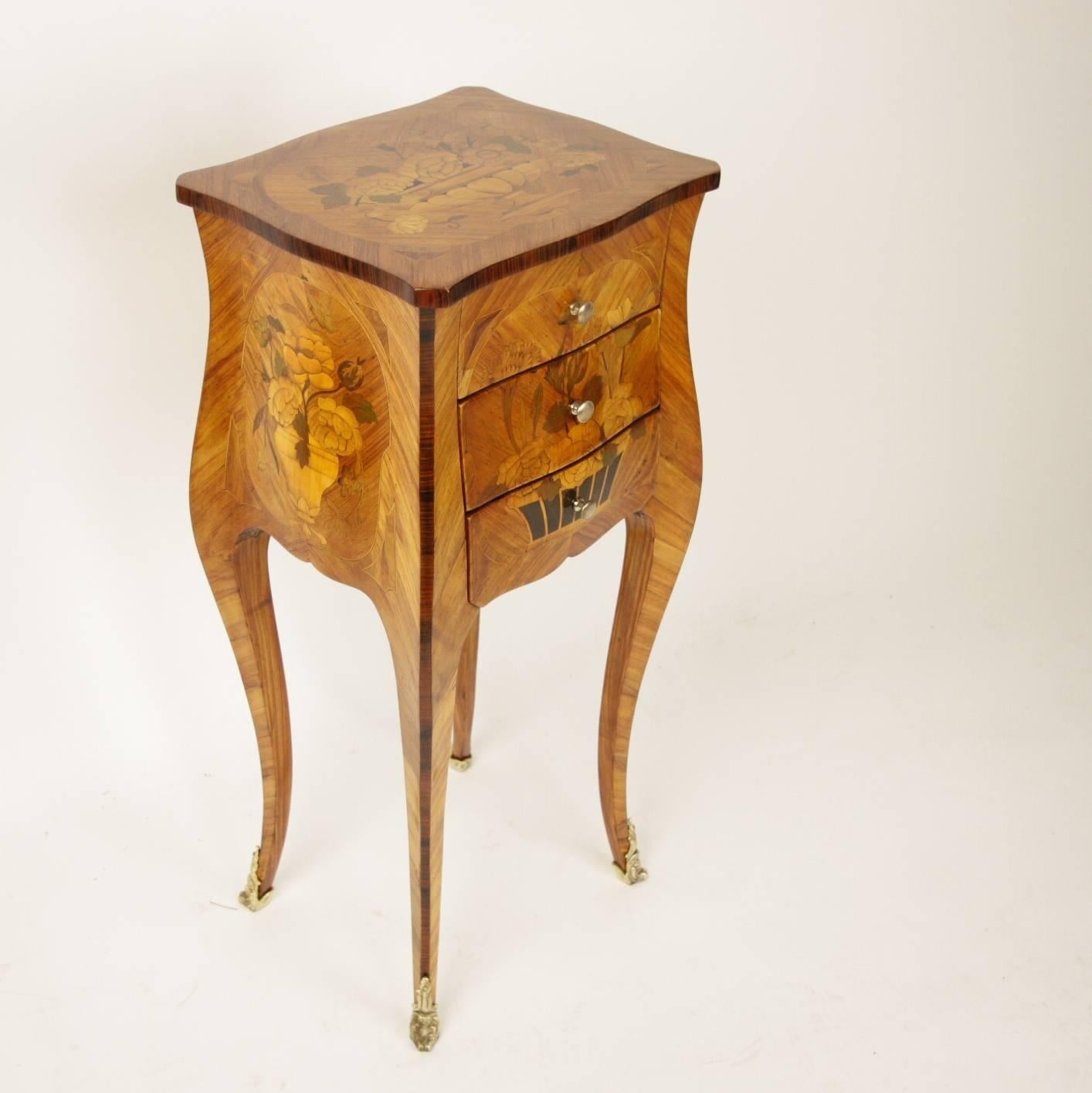 A 19th century Louis XV style side table or 'Table en Chiffonie`re' in the manner of Antoine-Louis Gosselin (1731 – 1794, maitre 1752). 

A marquetry side table, the serpentine top echoed by the serpentine front and sides. The front comprising three