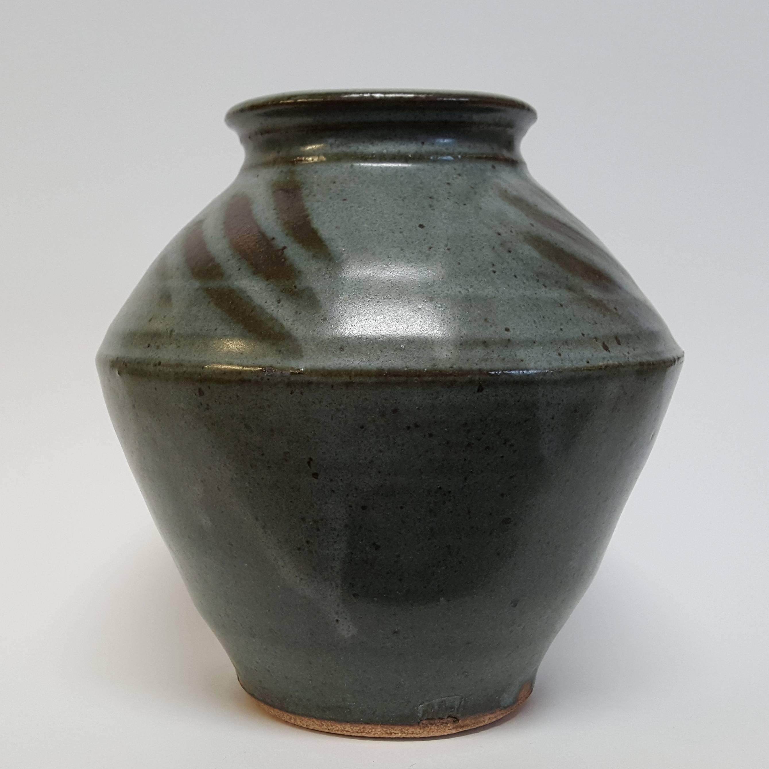 Warren MacKenzie (born 1924)
Blue vase with glaze decoration, n.d.
Stoneware
Measures: 7 x 7 inches
Artist’s stamp at base: M


MacKenzie's defining moment leading to his life's work began while he was a student at The Art Institute of