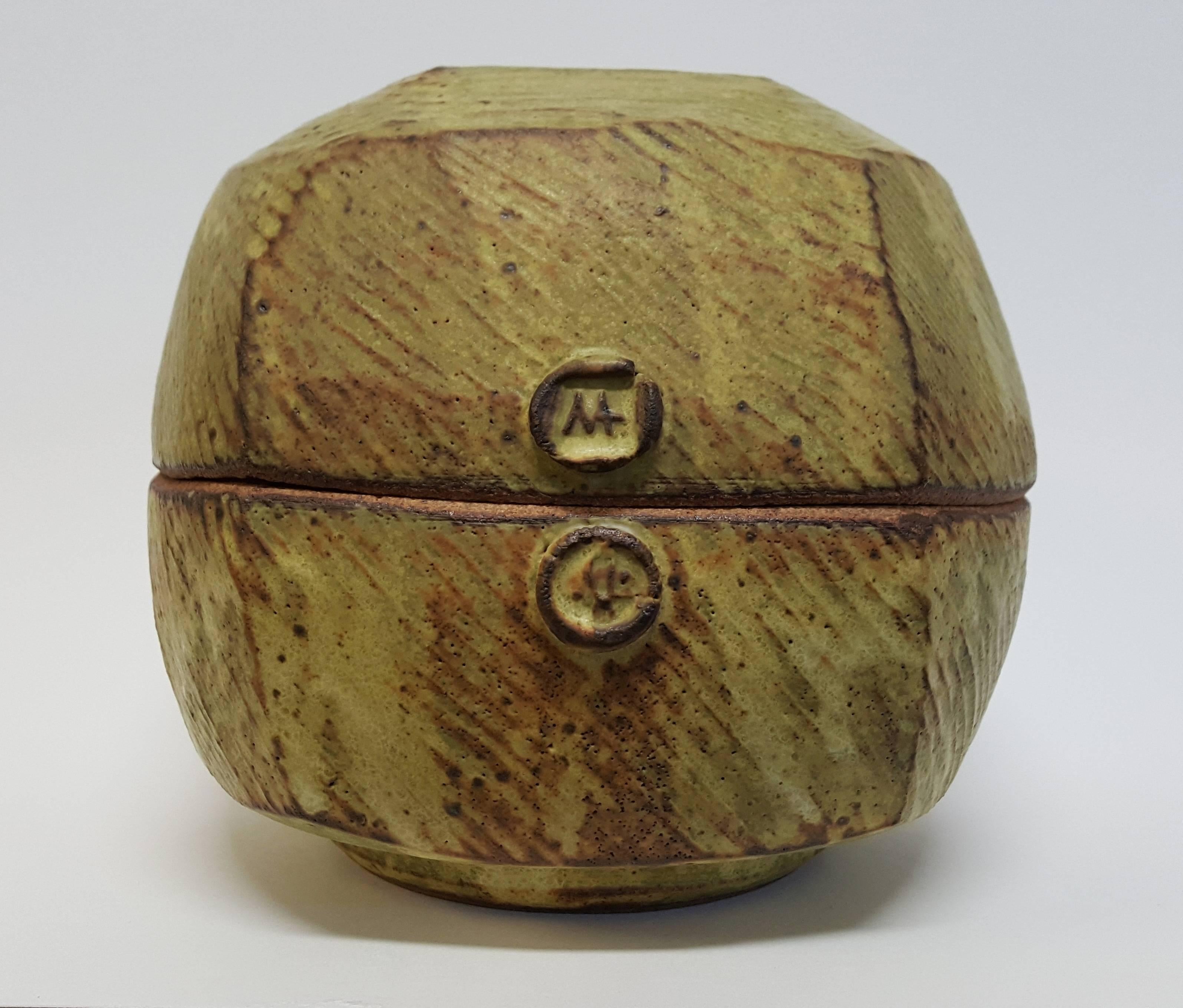 Warren Mackenzie (born 1924)
Five-sided button box, n.d.
Stoneware
Measures: 6 x 7 x 7 inches


MacKenzie's defining moment leading to his life's work began while he was a student at The Art Institute of Chicago when he came across a simple
