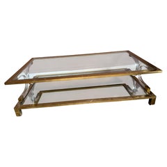 Hollywood Regency brass and lucite coffee table. Attributed to Maison Jansen