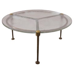 Table basse ronde en verre et bronze forgé, signée Lothar Klute