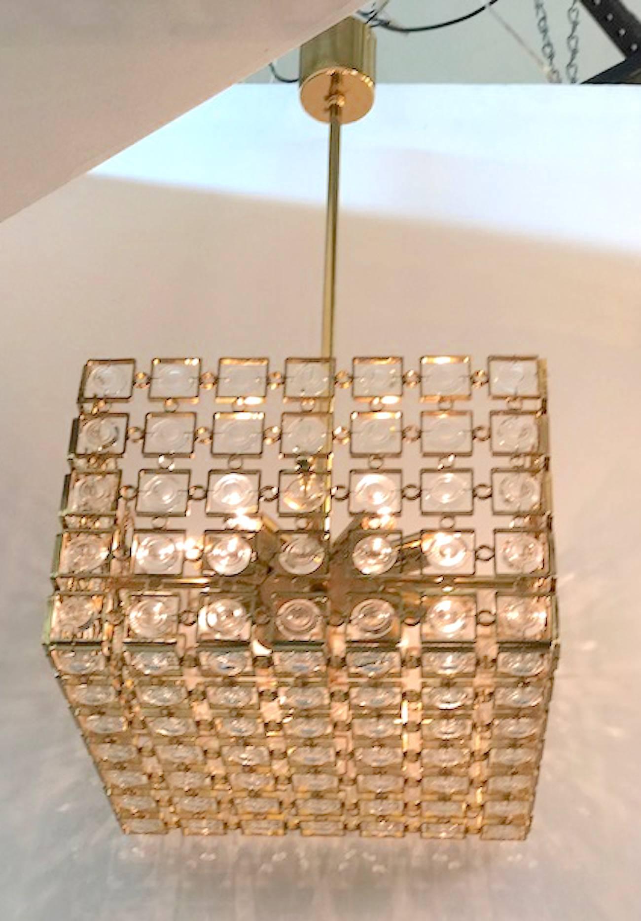 One of two available of this unique and beautiful Italian 1970s gold on brass and crystal cube shape chandelier attributed to Sciolari of Italy. Second chandelier is listing reference LU1029224067862. The four sides and bottom of the chandelier are