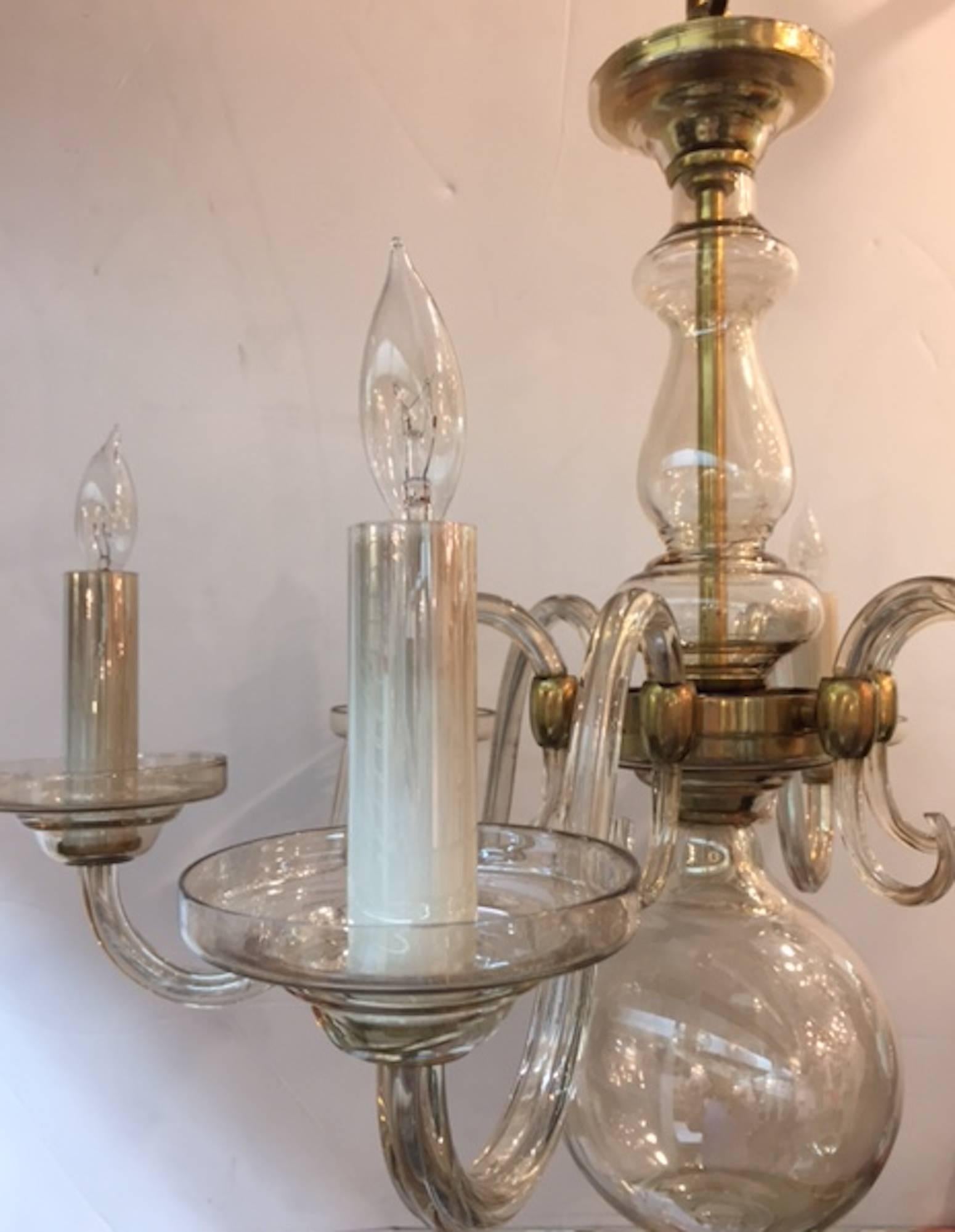 A lovely classical style six arm chandelier of iridescent pale champagne color. Each piece handblown in Murano, Italy, circa 1950. All original with matching blown glass candle socket covers. Light iridescent finish to glass. Satin finish brass