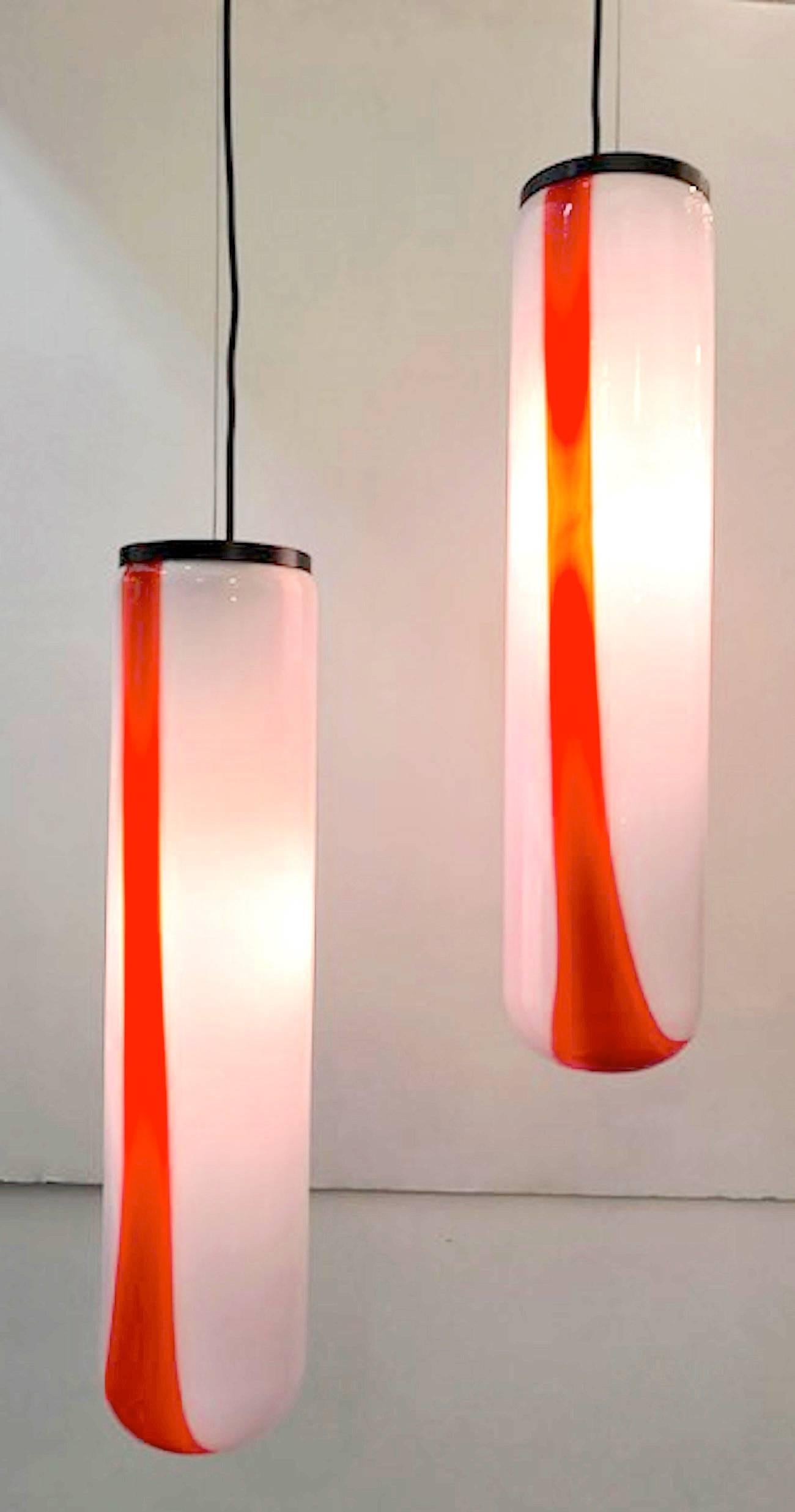A wonderful and large Italian glass tube pendant lights, circa 1970 by Italian lighting company Vistosi of Murano. Originally a pair and now one available. The shade is uniquely handblown in white glass with a red and orange stripe. The red and