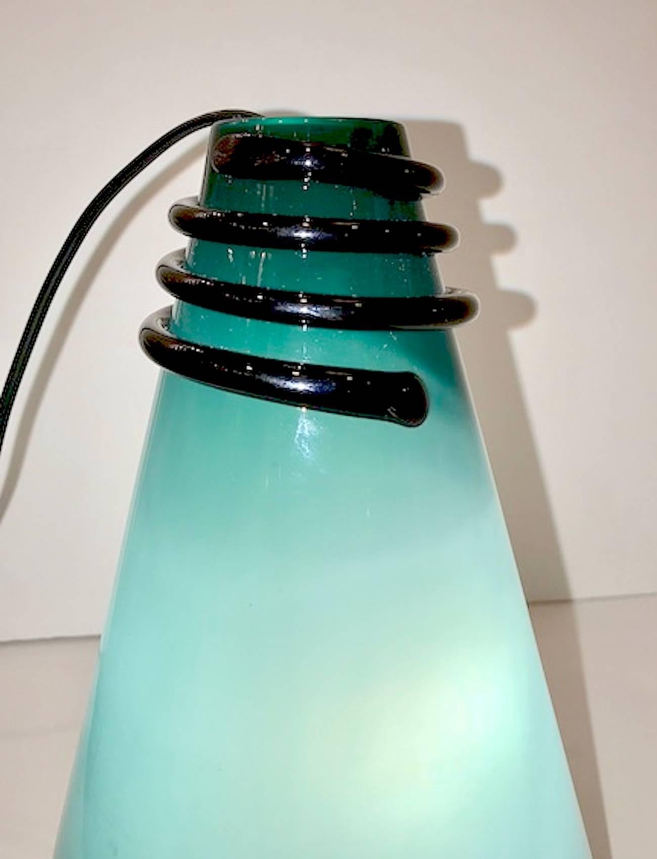 A signed VeArt Venezia green over white case glass with black accent cone vase or table lamp from 1983 in the Menphis style.